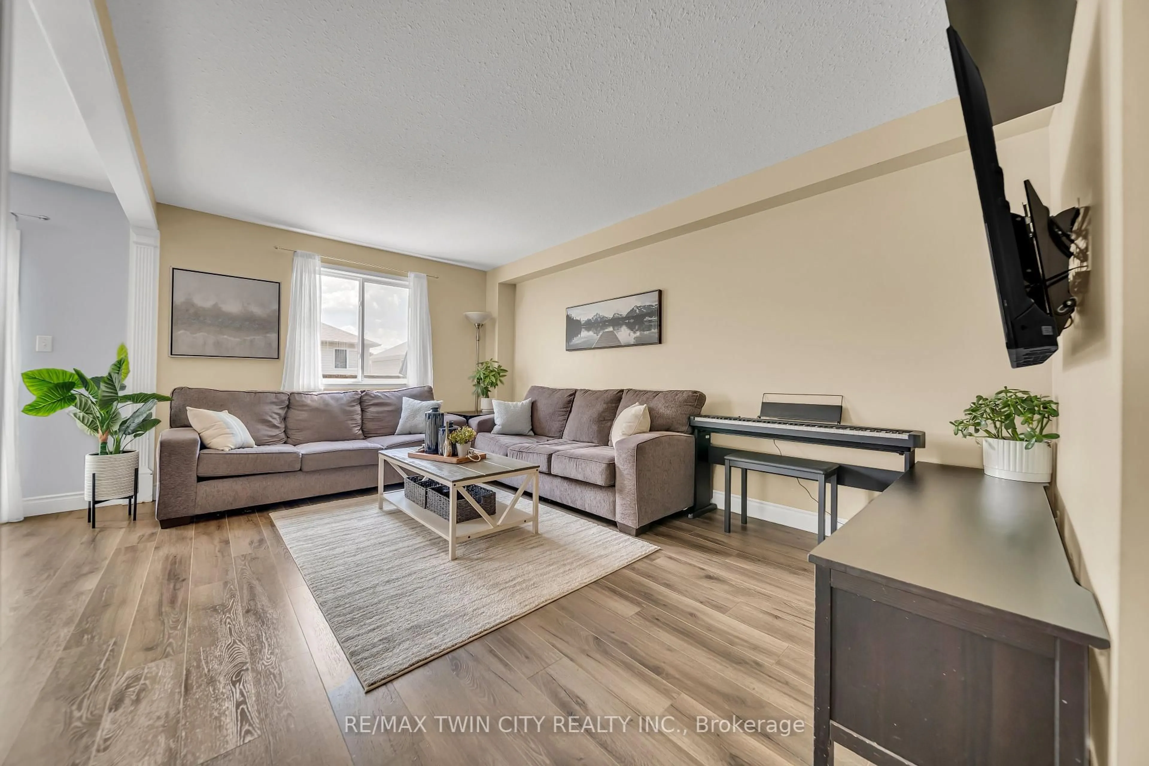 Living room with furniture, wood/laminate floor for 156 Prosperity Dr, Kitchener Ontario N2E 4E8