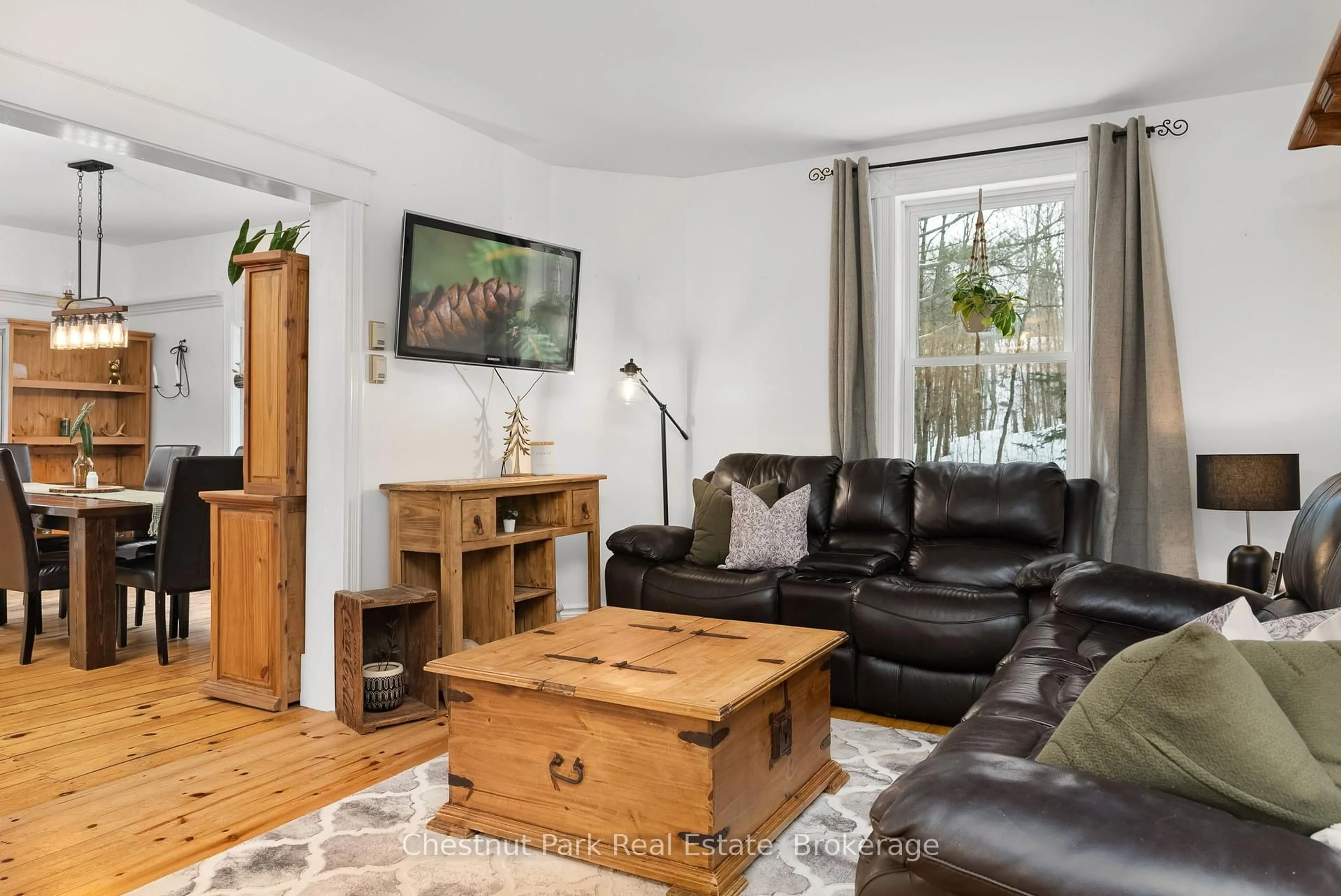 Living room with furniture, wood/laminate floor for 1236 Butter & Egg Rd, Muskoka Lakes Ontario P1L 1X4