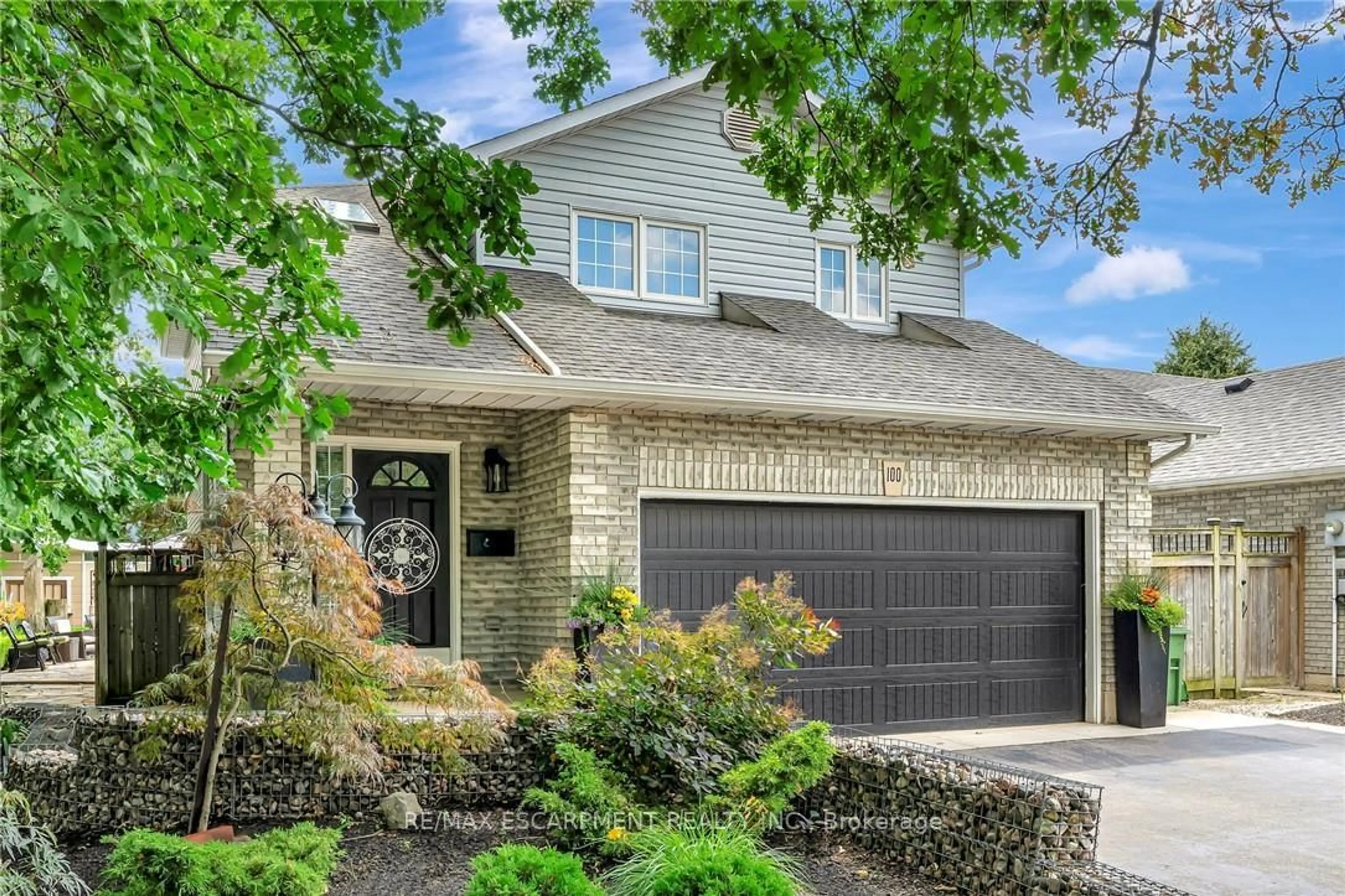 Home with brick exterior material, street for 100 Stone Church Rd, Hamilton Ontario L9B 1A9