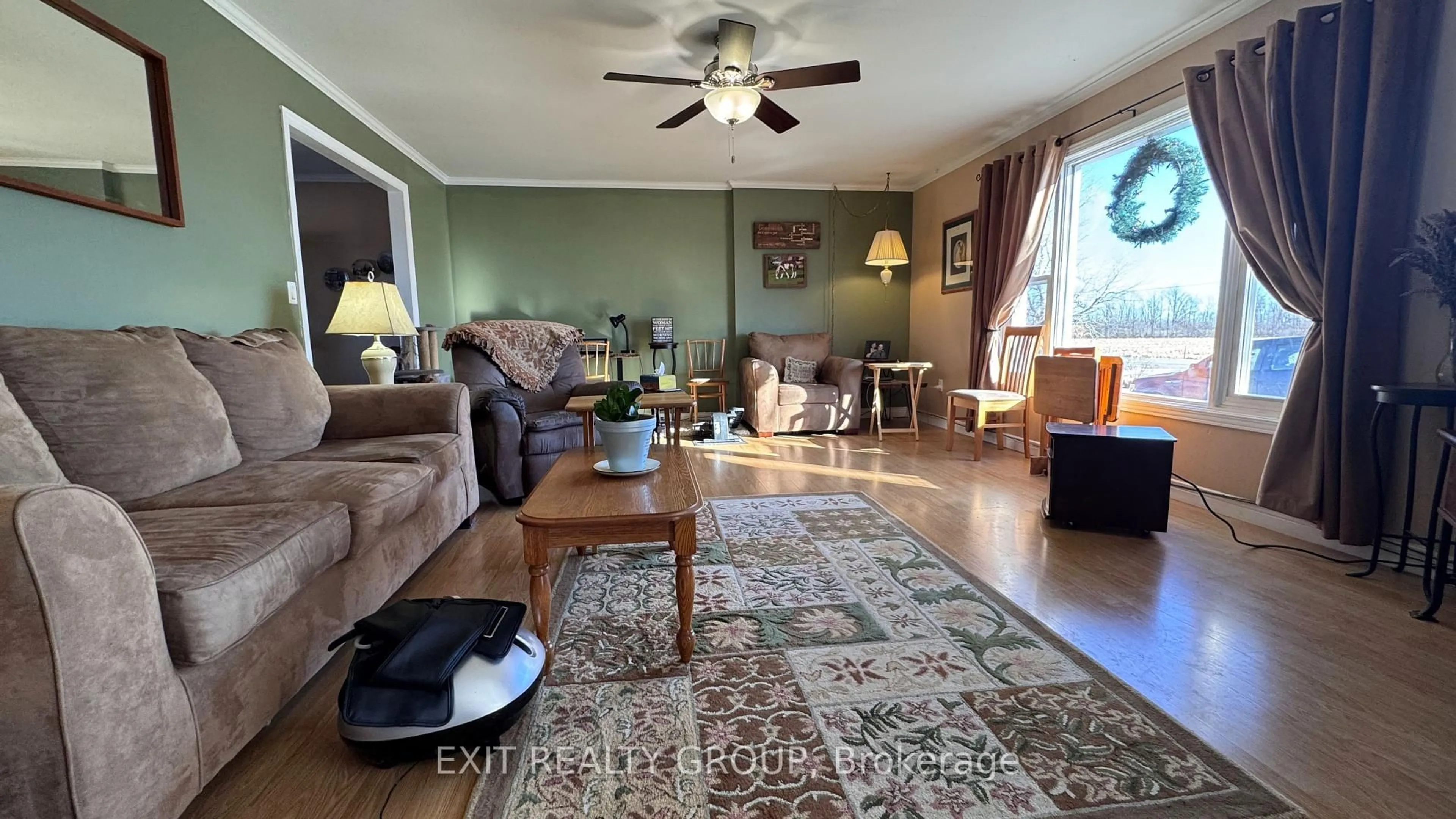 Living room with furniture, wood/laminate floor for 105 County Road 12, Greater Napanee Ontario K0K 2W0