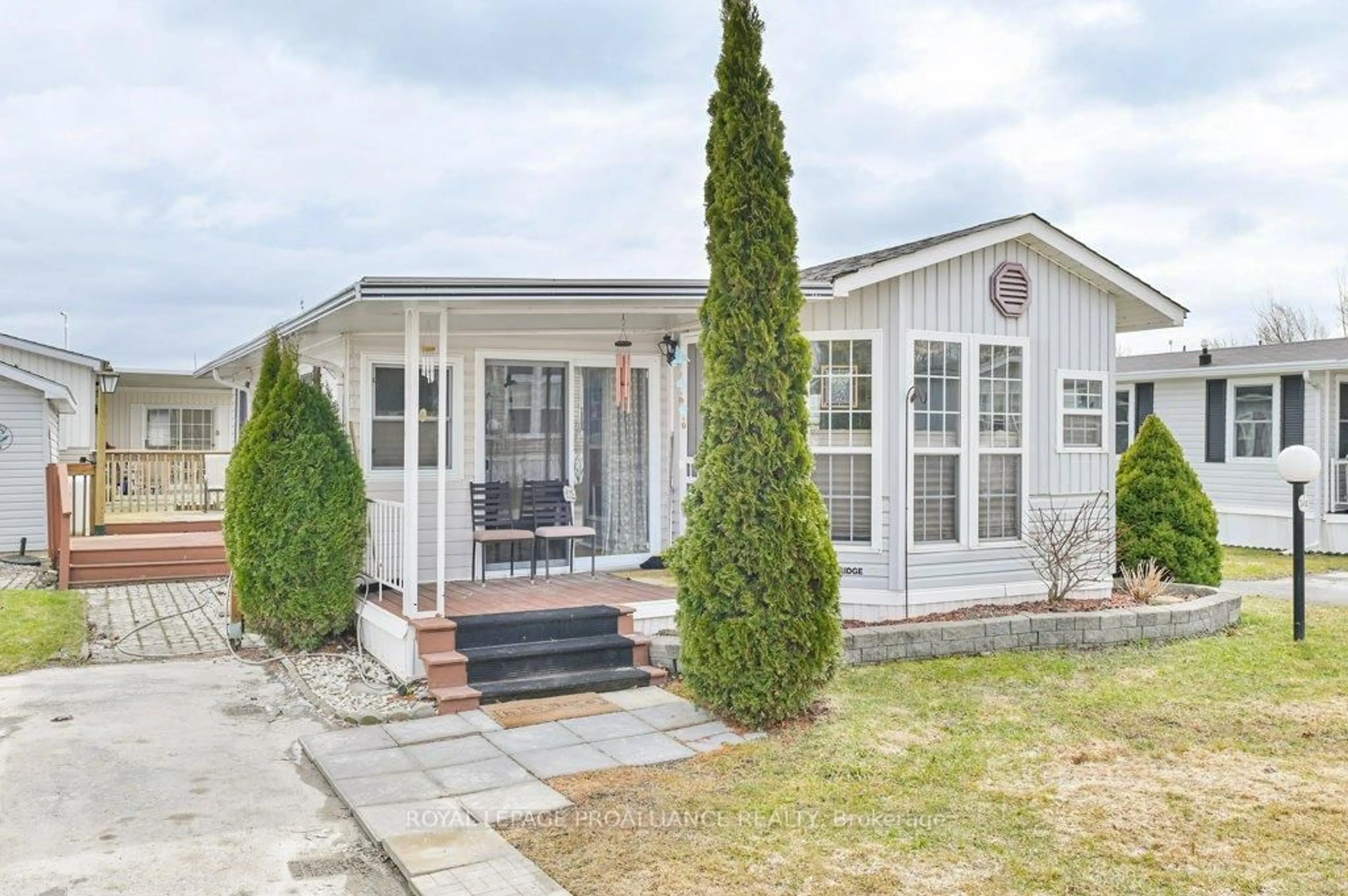 Home with vinyl exterior material, street for 153 County Road 27 #D12, Prince Edward County Ontario K0K 1T0
