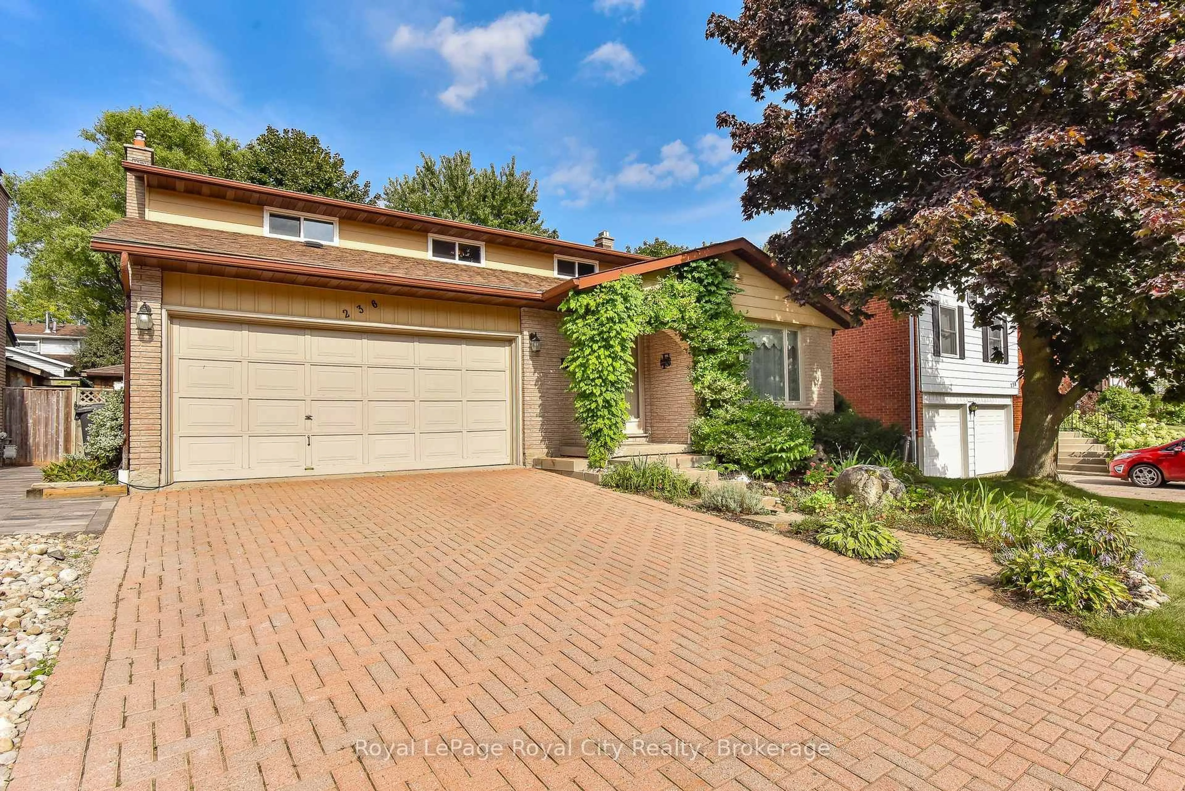 Home with brick exterior material, street for 236 Ironwood Rd, Guelph Ontario N1G 3G1