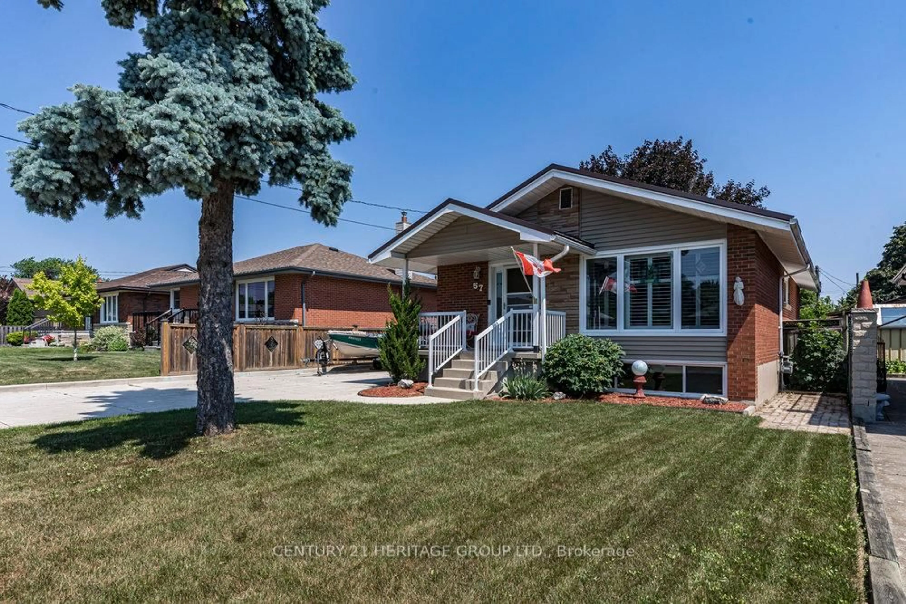 Home with brick exterior material, street for 57 Burfield Ave, Hamilton Ontario L8T 2J8