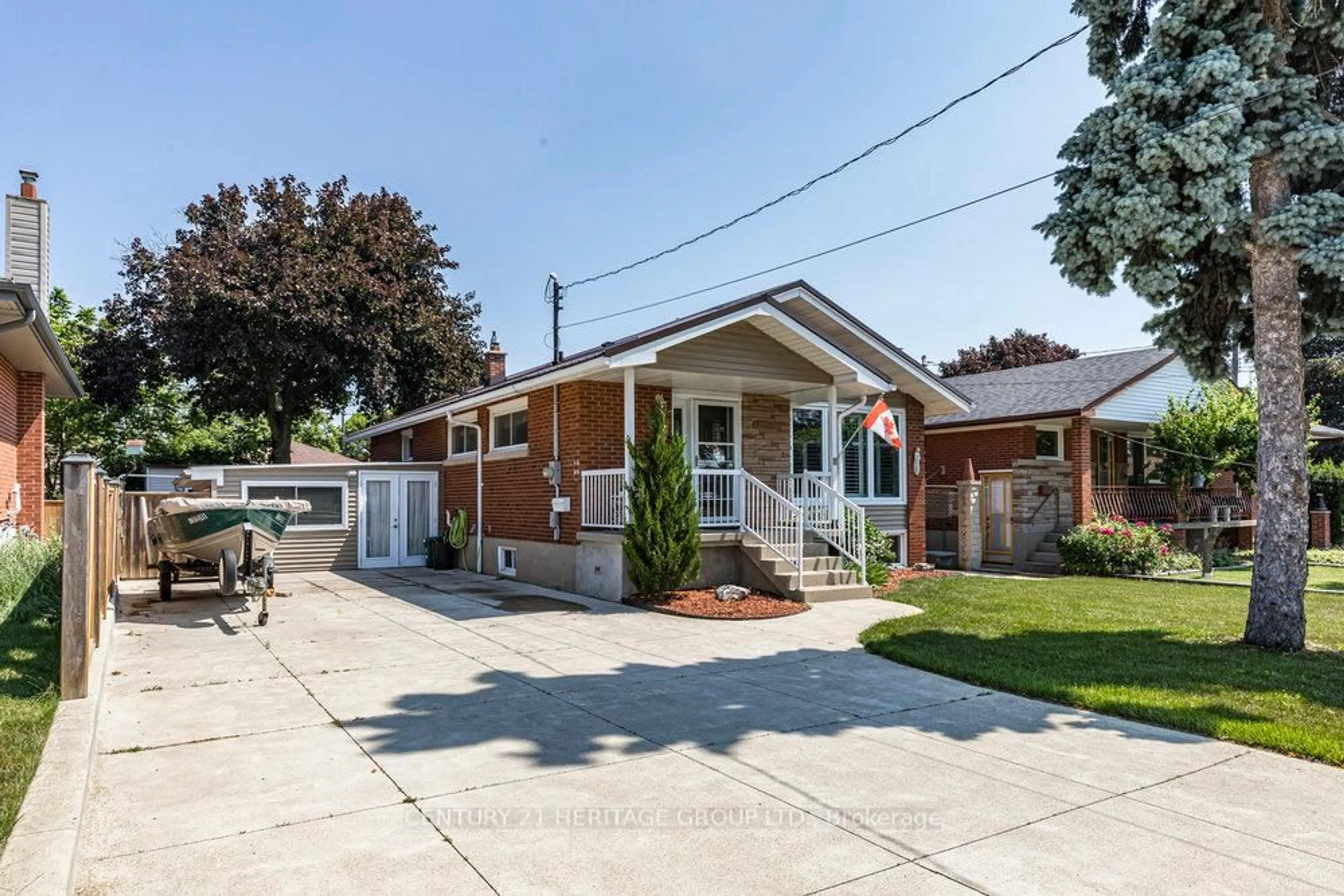 Home with brick exterior material, street for 57 Burfield Ave, Hamilton Ontario L8T 2J8