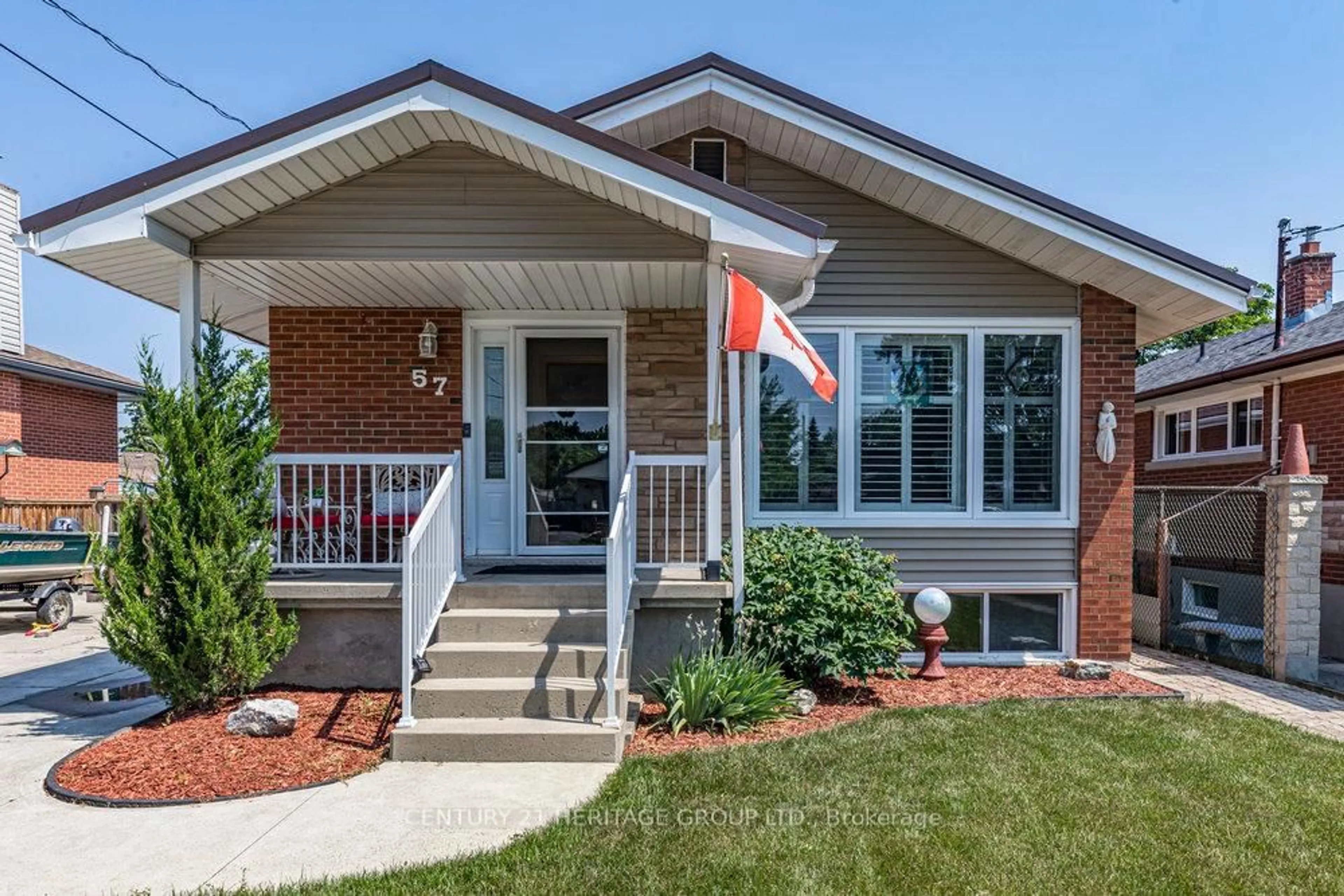 Home with brick exterior material, street for 57 Burfield Ave, Hamilton Ontario L8T 2J8
