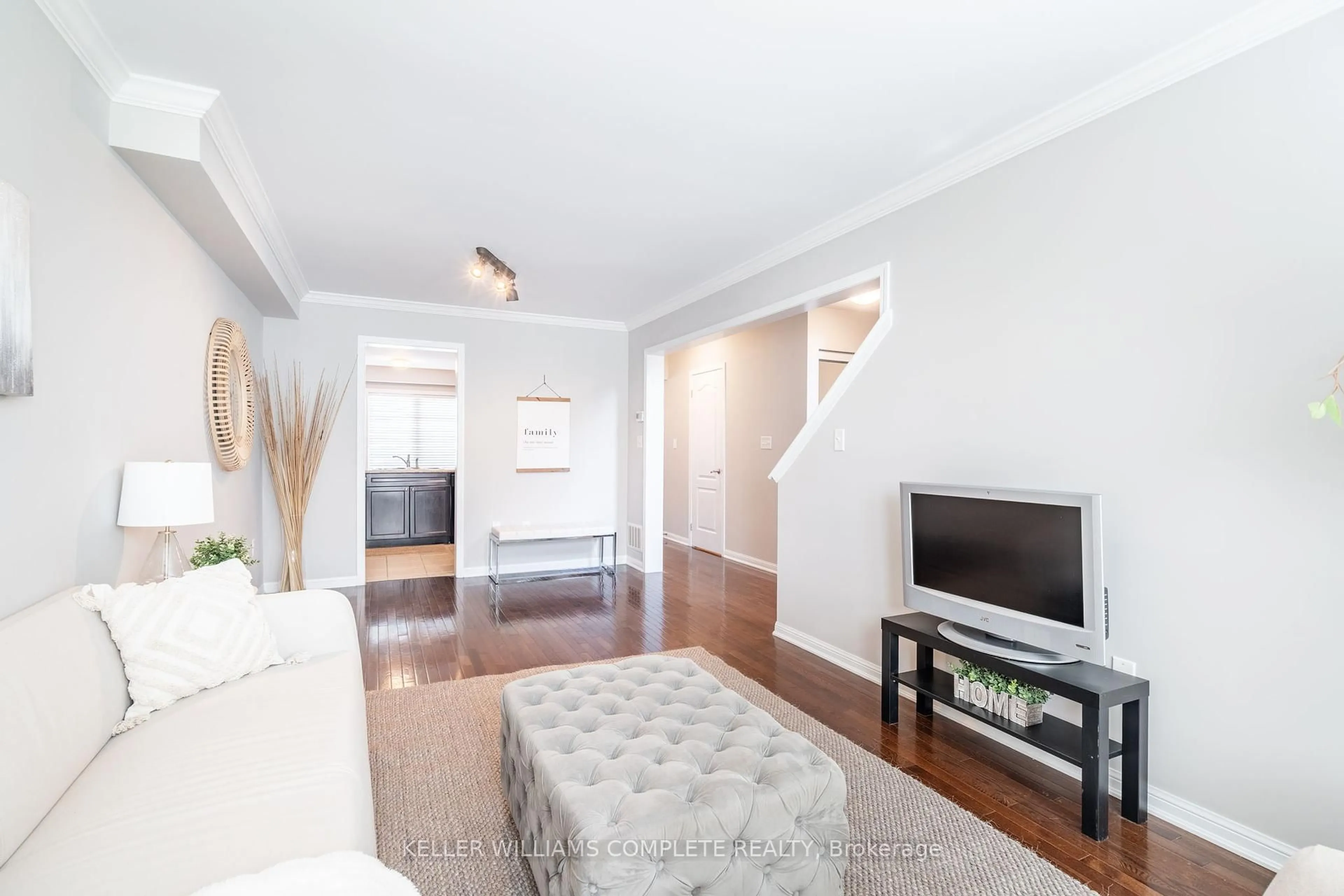 Living room with furniture, wood/laminate floor for 69 Hepworth Cres, Hamilton Ontario L9K 0C4