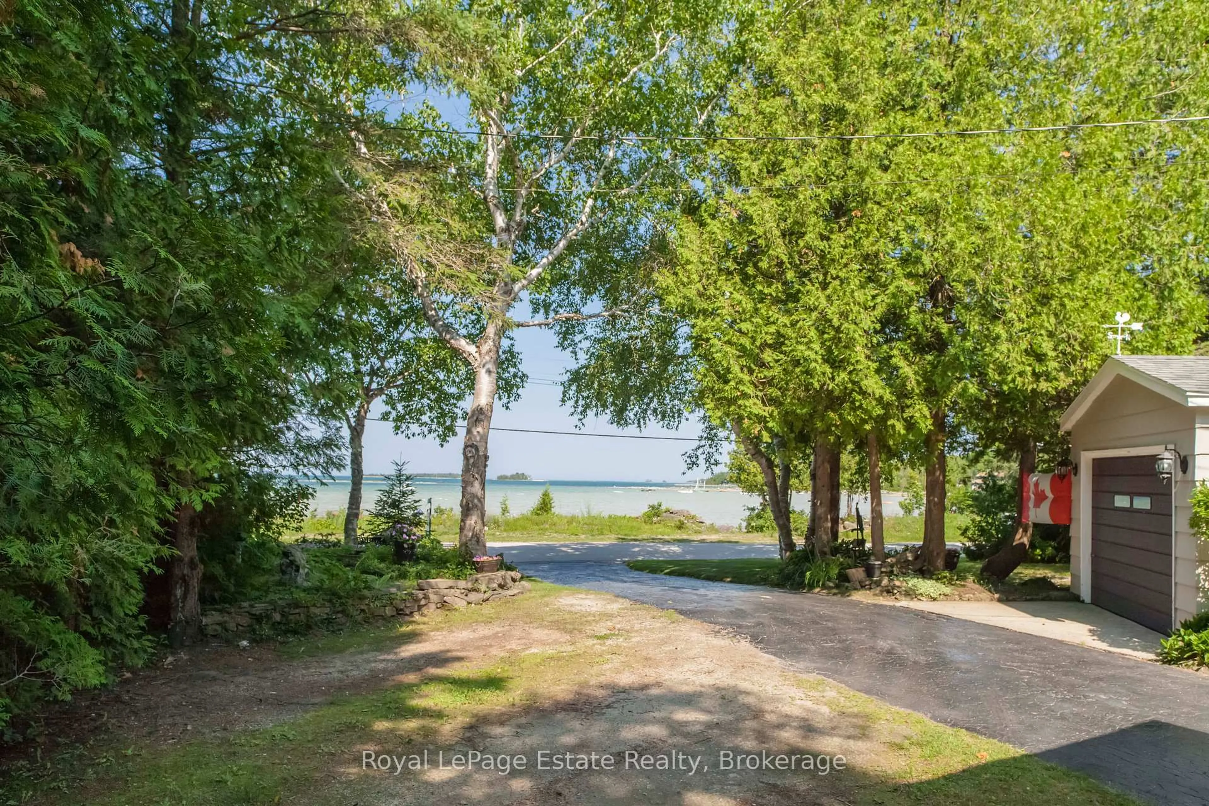 A pic from outside/outdoor area/front of a property/back of a property/a pic from drone, water/lake/river/ocean view for 371 Bay St, South Bruce Peninsula Ontario N0H 2T0