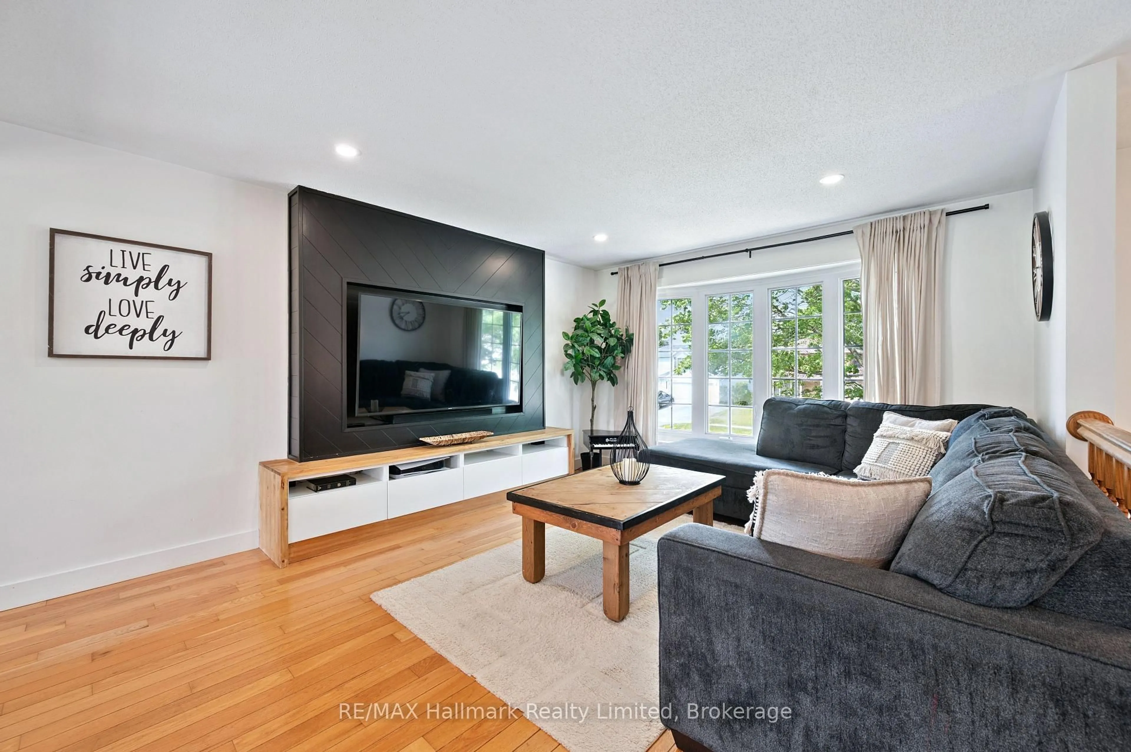 Living room with furniture, wood/laminate floor for 339 Imperial Rd, Guelph Ontario N1K 1L7