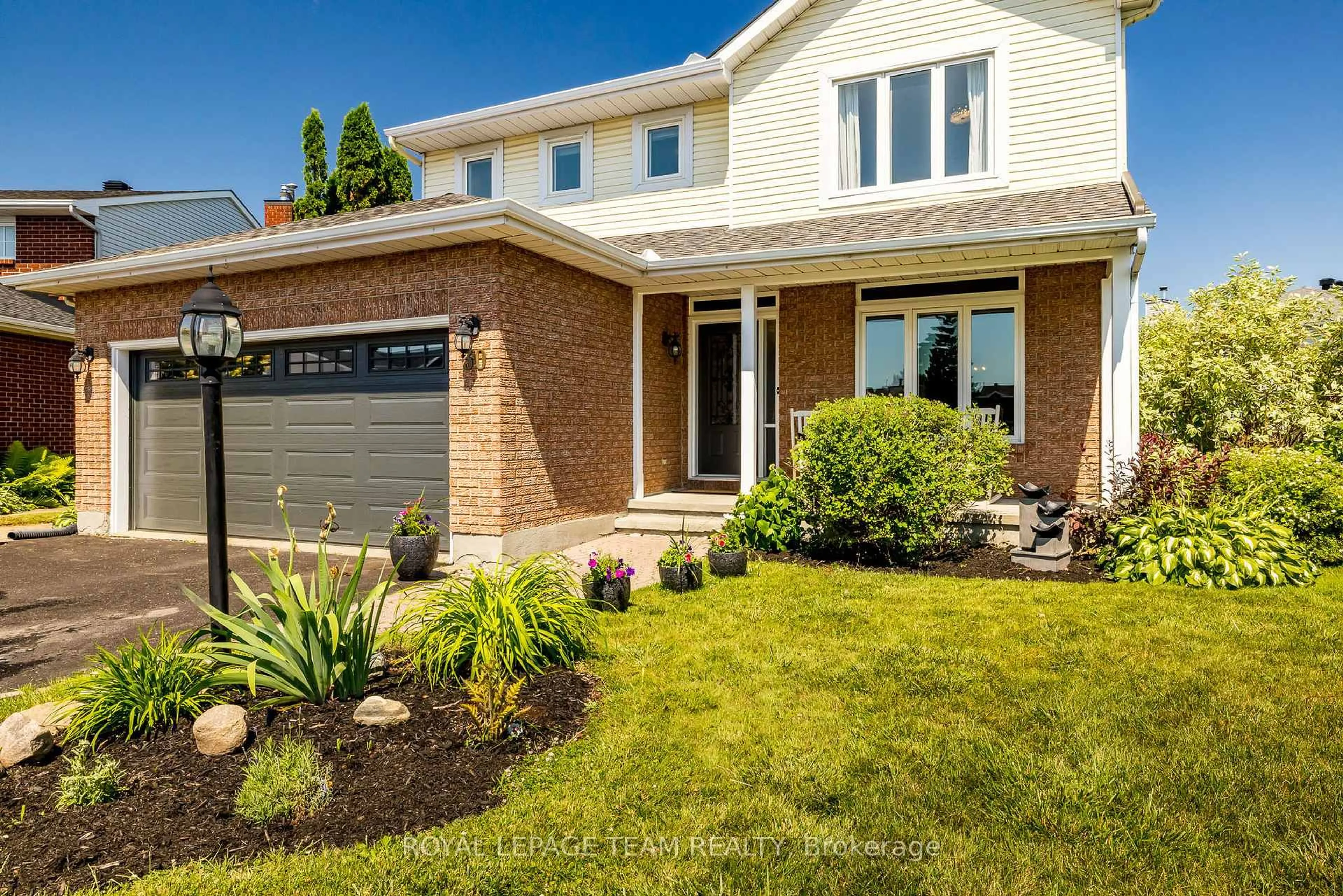 Home with brick exterior material, street for 30 Halley St, Barrhaven Ontario K2J 3W2