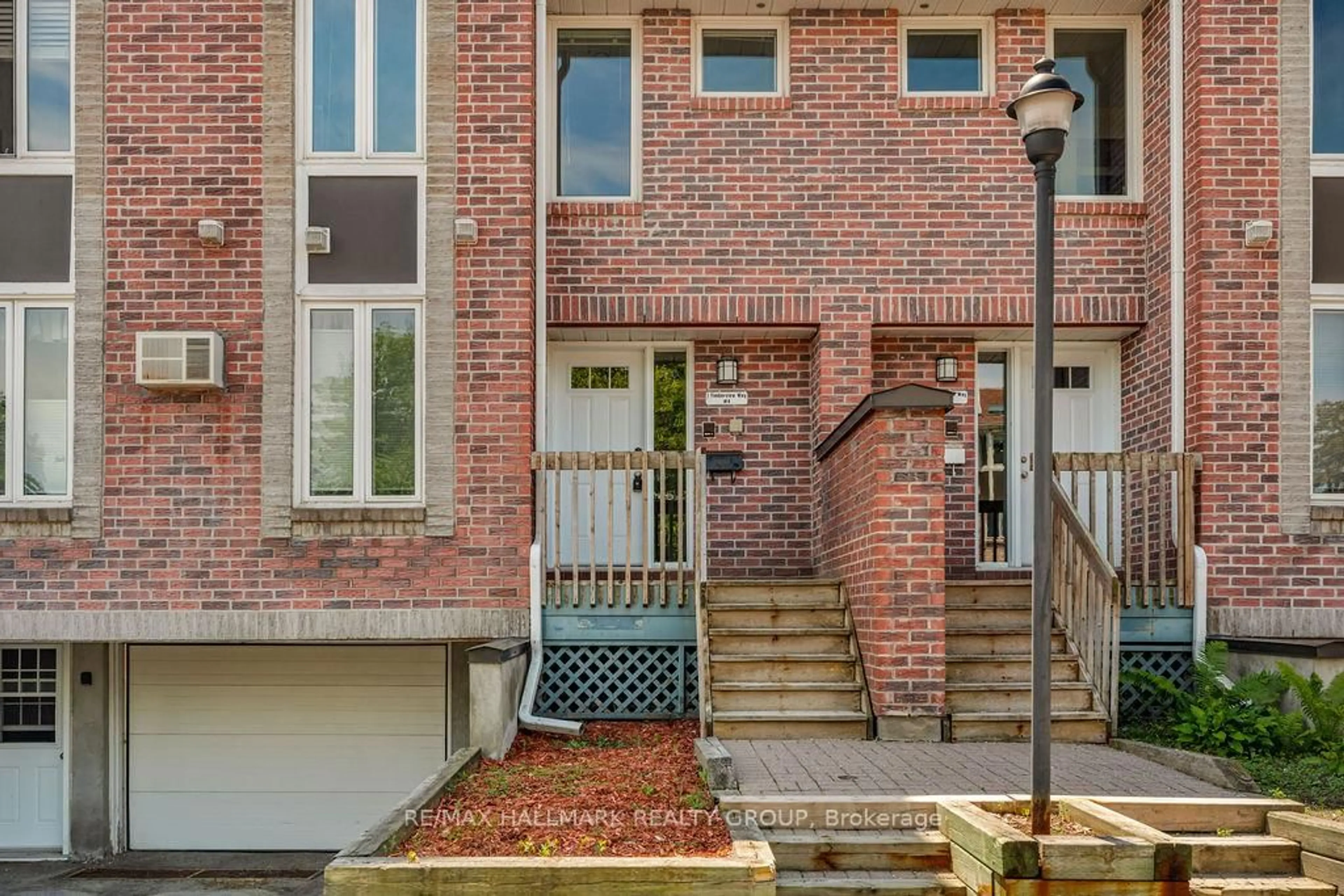 Home with brick exterior material, street for 1 Timberview Way #4, Nepean Ontario K2H 9M7