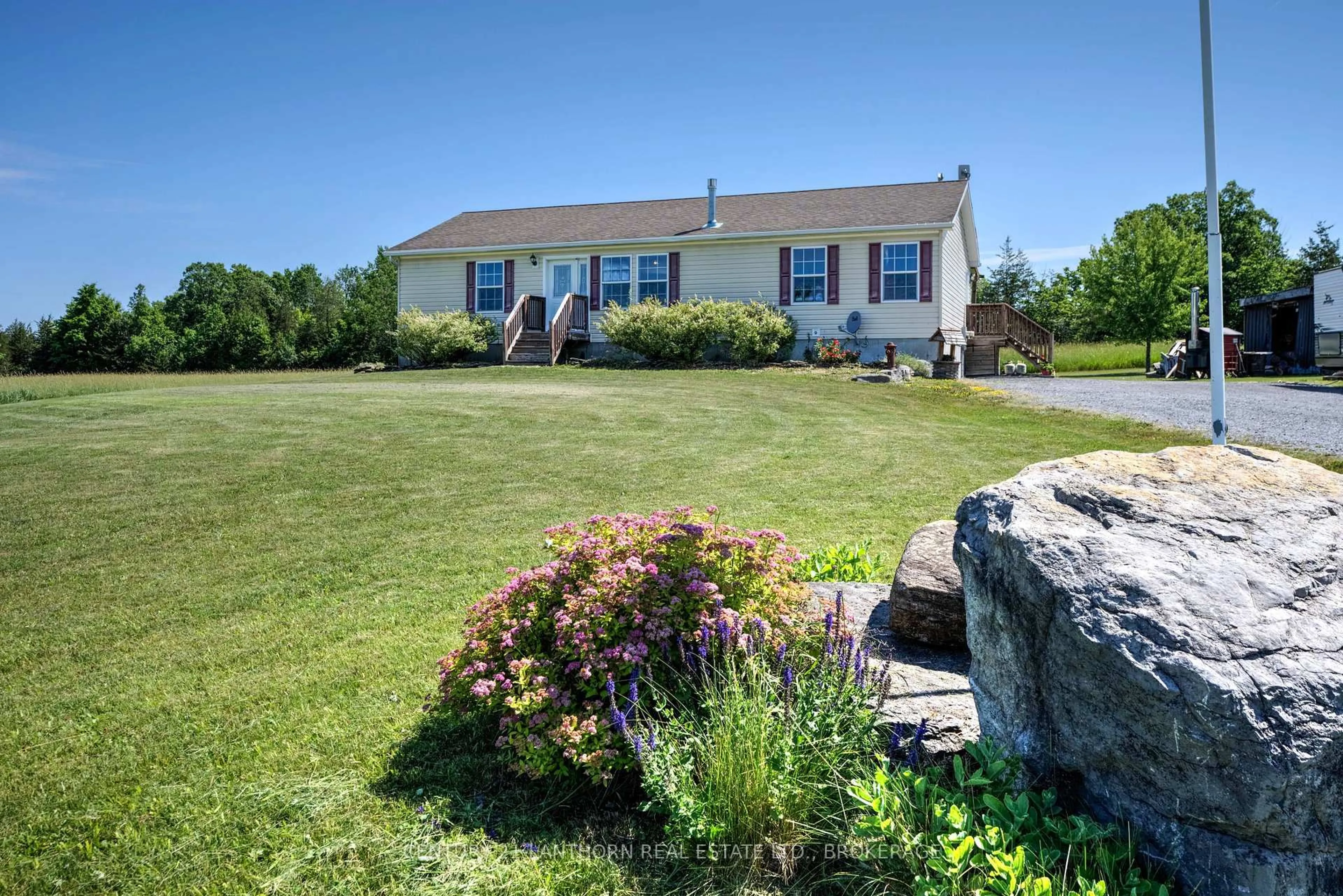 A pic from outside/outdoor area/front of a property/back of a property/a pic from drone, water/lake/river/ocean view for 1043 County Road 12 Rd, Greater Napanee Ontario K0K 2W0