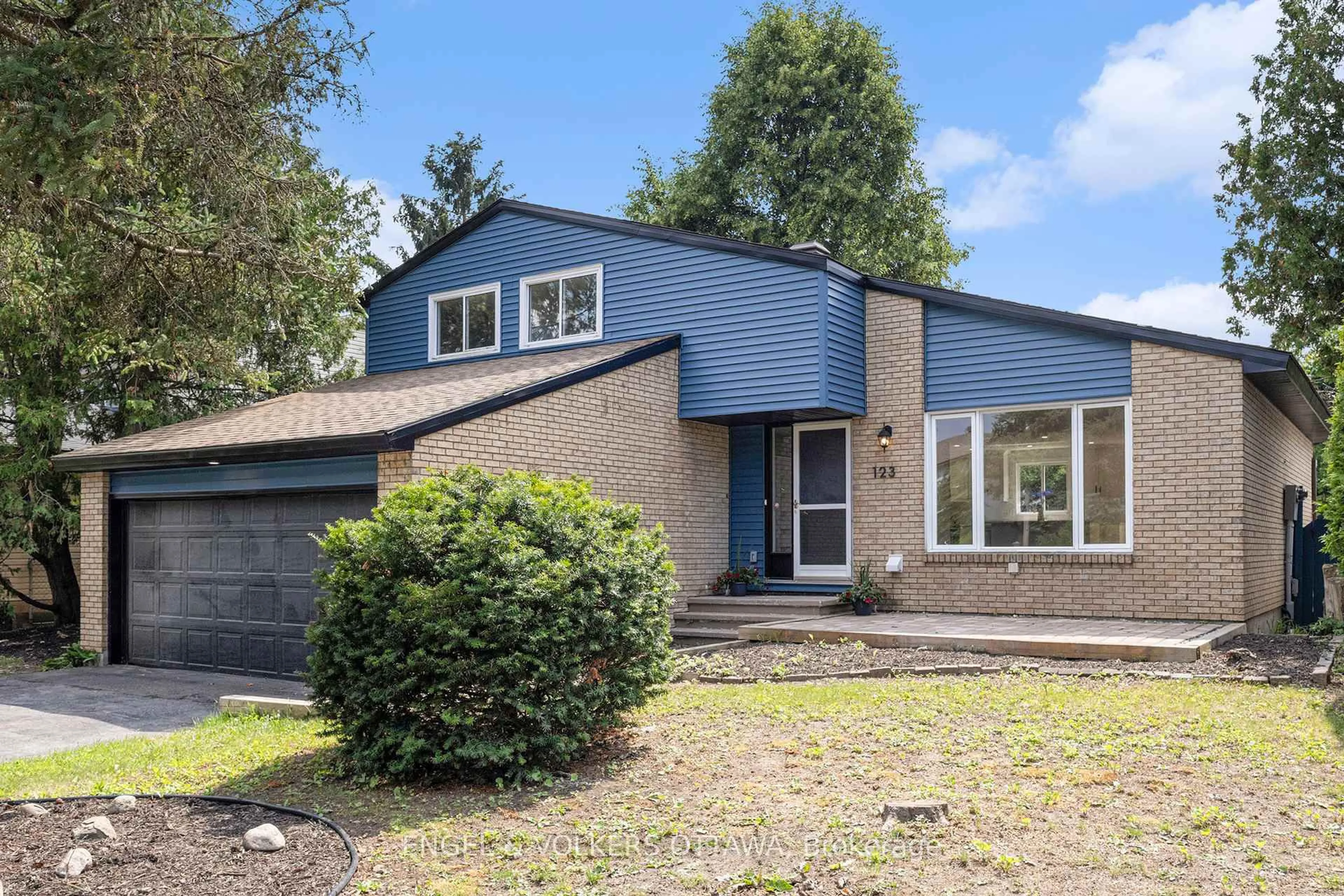 Home with vinyl exterior material, street for 123 Tripp Cres, Ottawa Ontario K2J 1M5