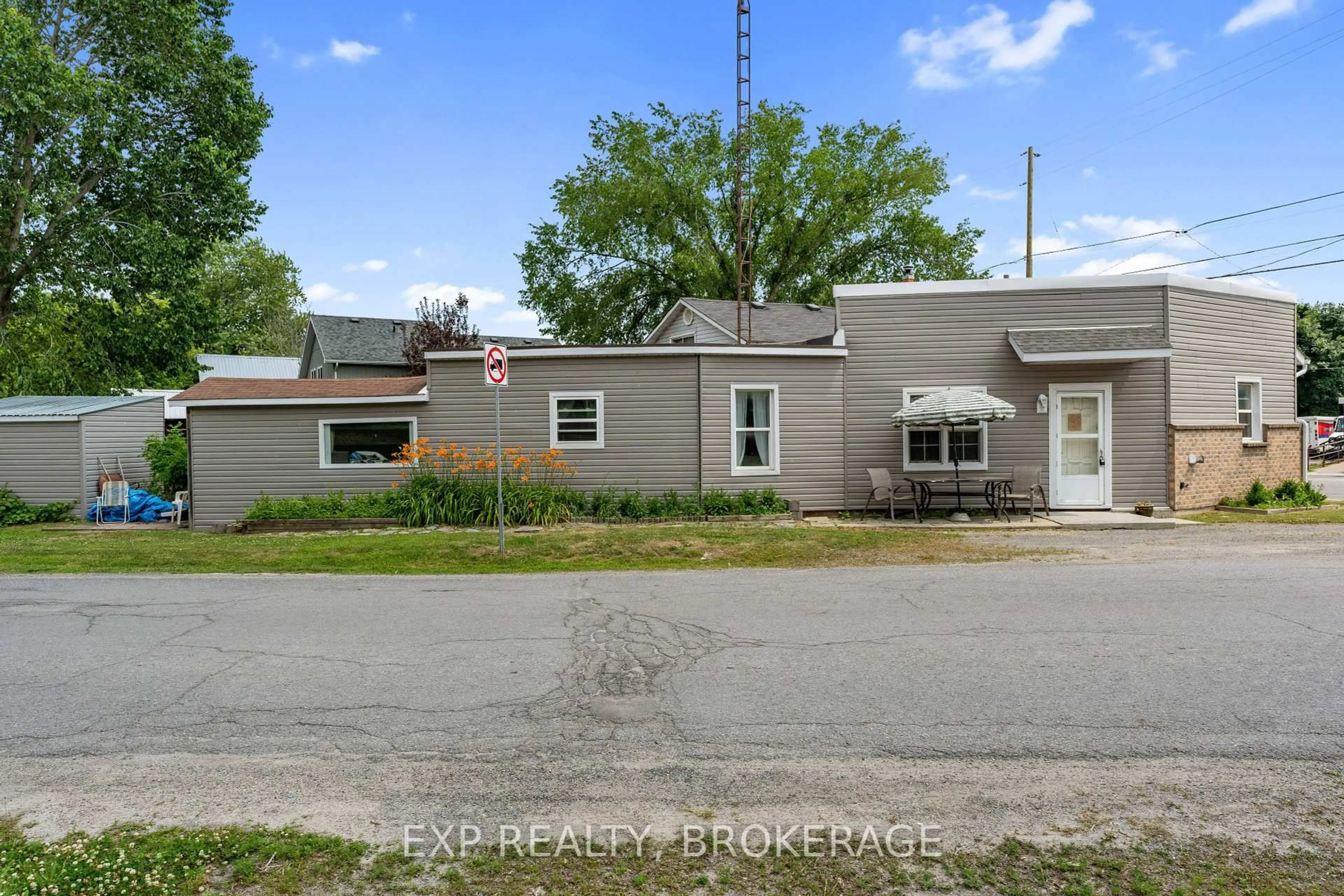 A pic from outside/outdoor area/front of a property/back of a property/a pic from drone, street for 90 Main St, Battersea Ontario K0H 1H0