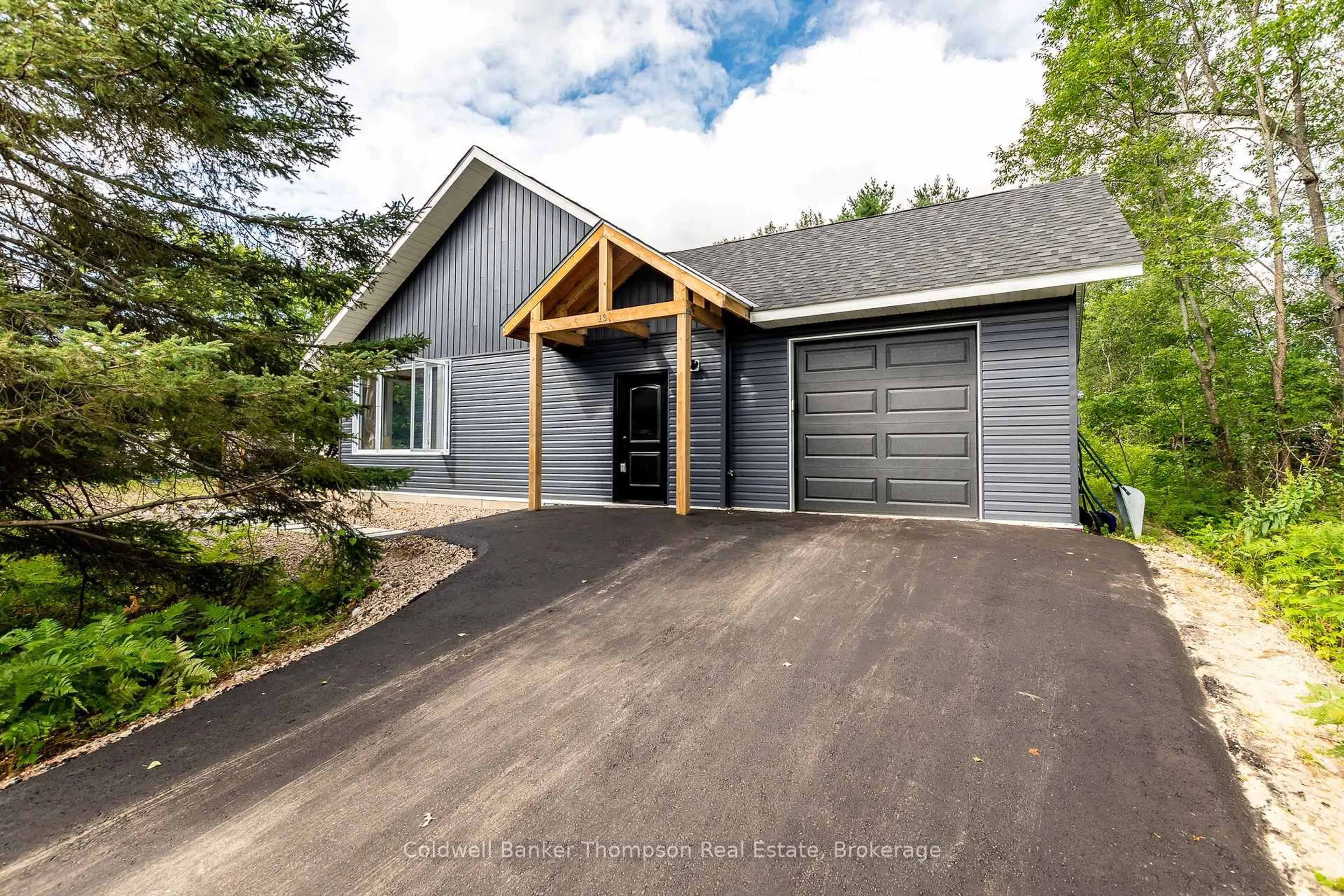 Home with vinyl exterior material, street for 13 Lewis St, South River Ontario P0A 1X0