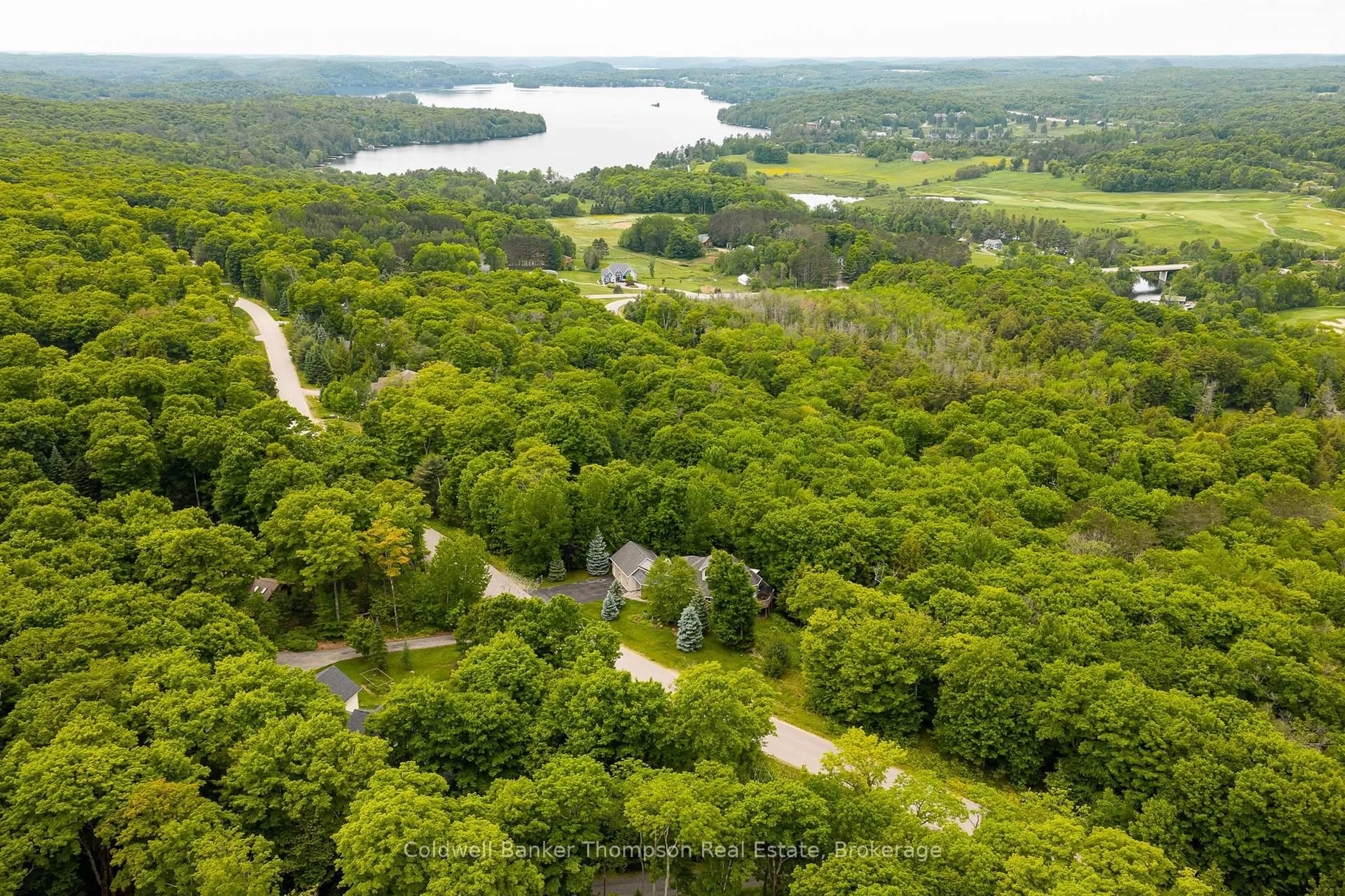 A pic from outside/outdoor area/front of a property/back of a property/a pic from drone, forest/trees view for 30 Deerfoot Tr, Huntsville Ontario P1H 0A6