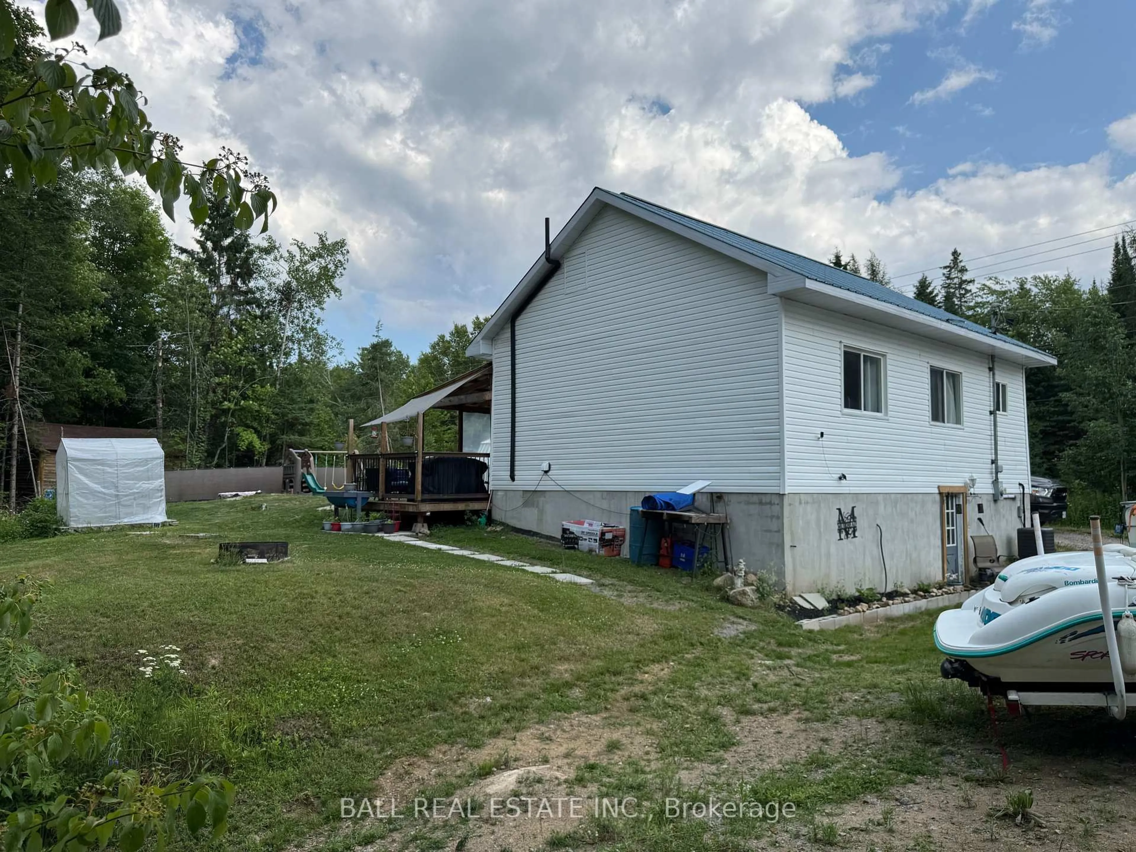 A pic from outside/outdoor area/front of a property/back of a property/a pic from drone, unknown for 10419 County Road 503, Highlands East Ontario K0M 1R0