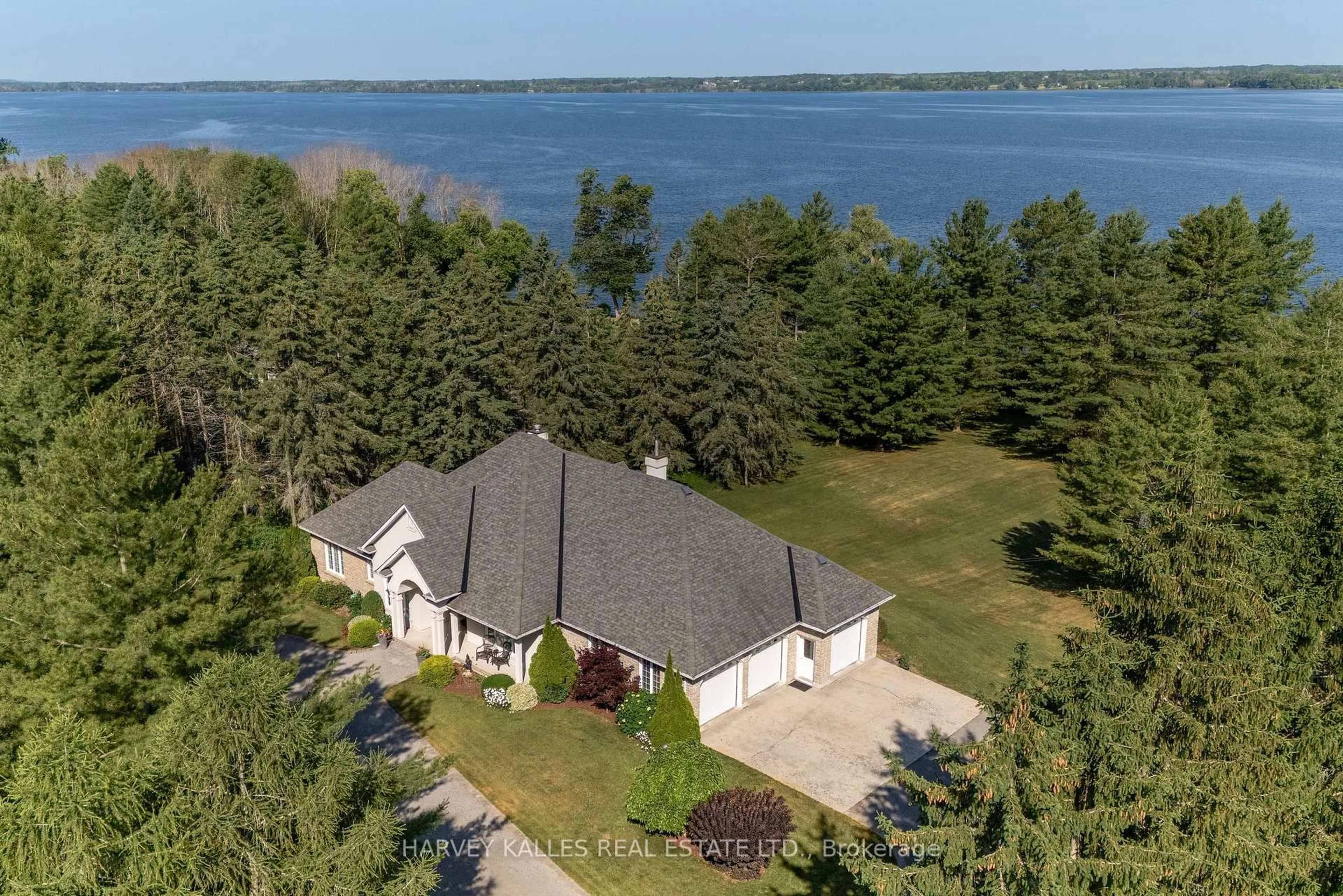 A pic from outside/outdoor area/front of a property/back of a property/a pic from drone, water/lake/river/ocean view for 3605 County Rd 7, Prince Edward County Ontario K0K 2T0