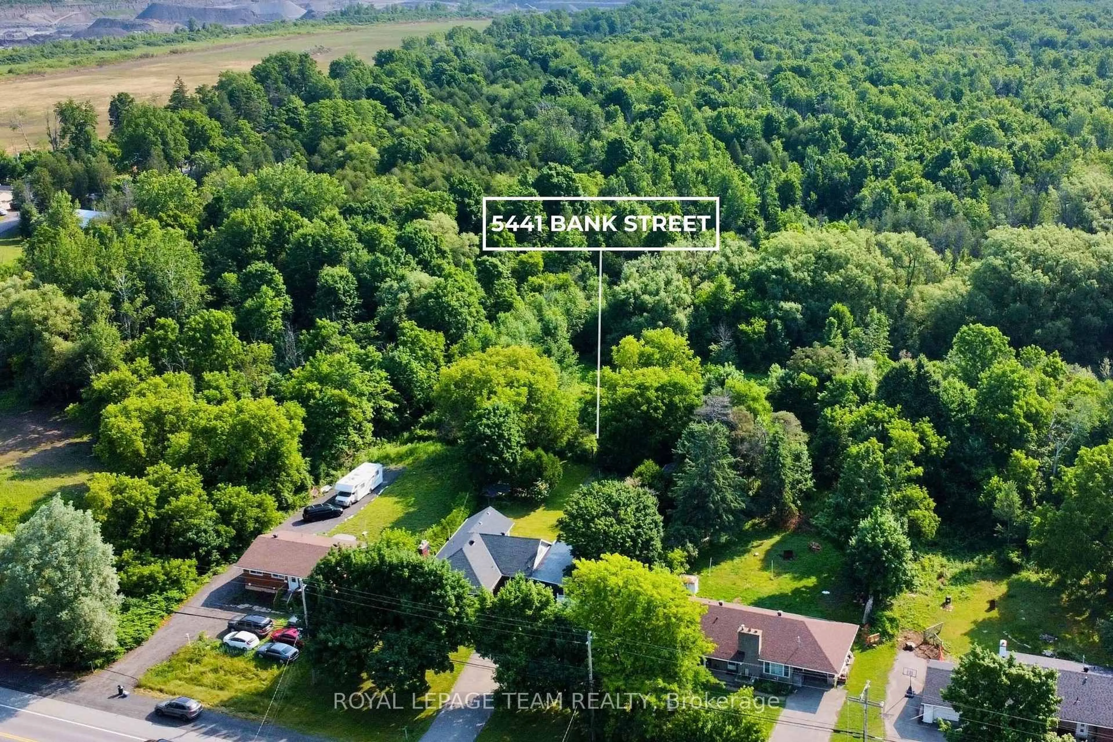 A pic from outside/outdoor area/front of a property/back of a property/a pic from drone, forest/trees view for 5441 Bank St, Ottawa Ontario K1X 1G9