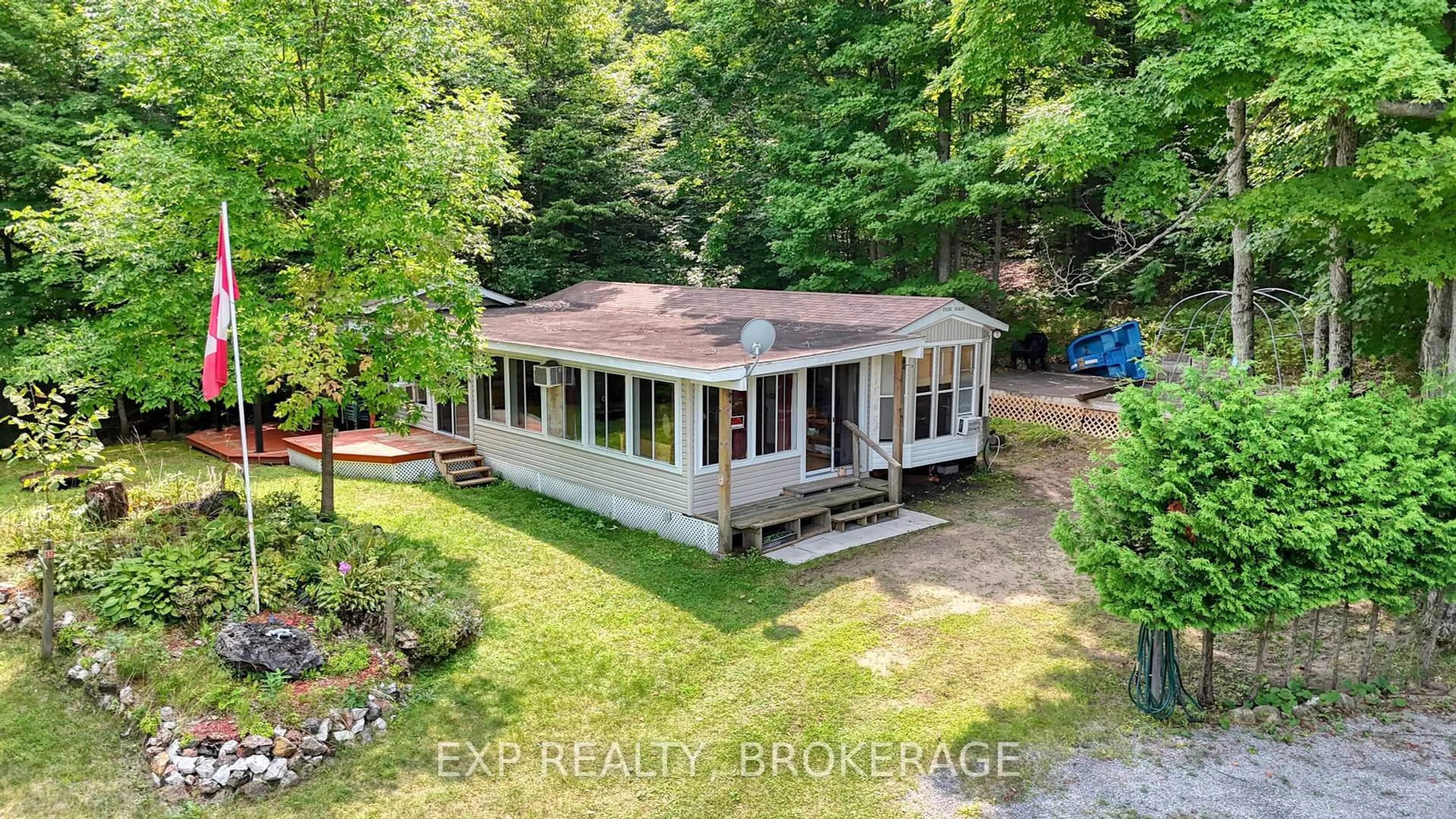 A pic from outside/outdoor area/front of a property/back of a property/a pic from drone, water/lake/river/ocean view for 9 GLENFORD Lane #20, Godfrey Ontario K0H 1T0