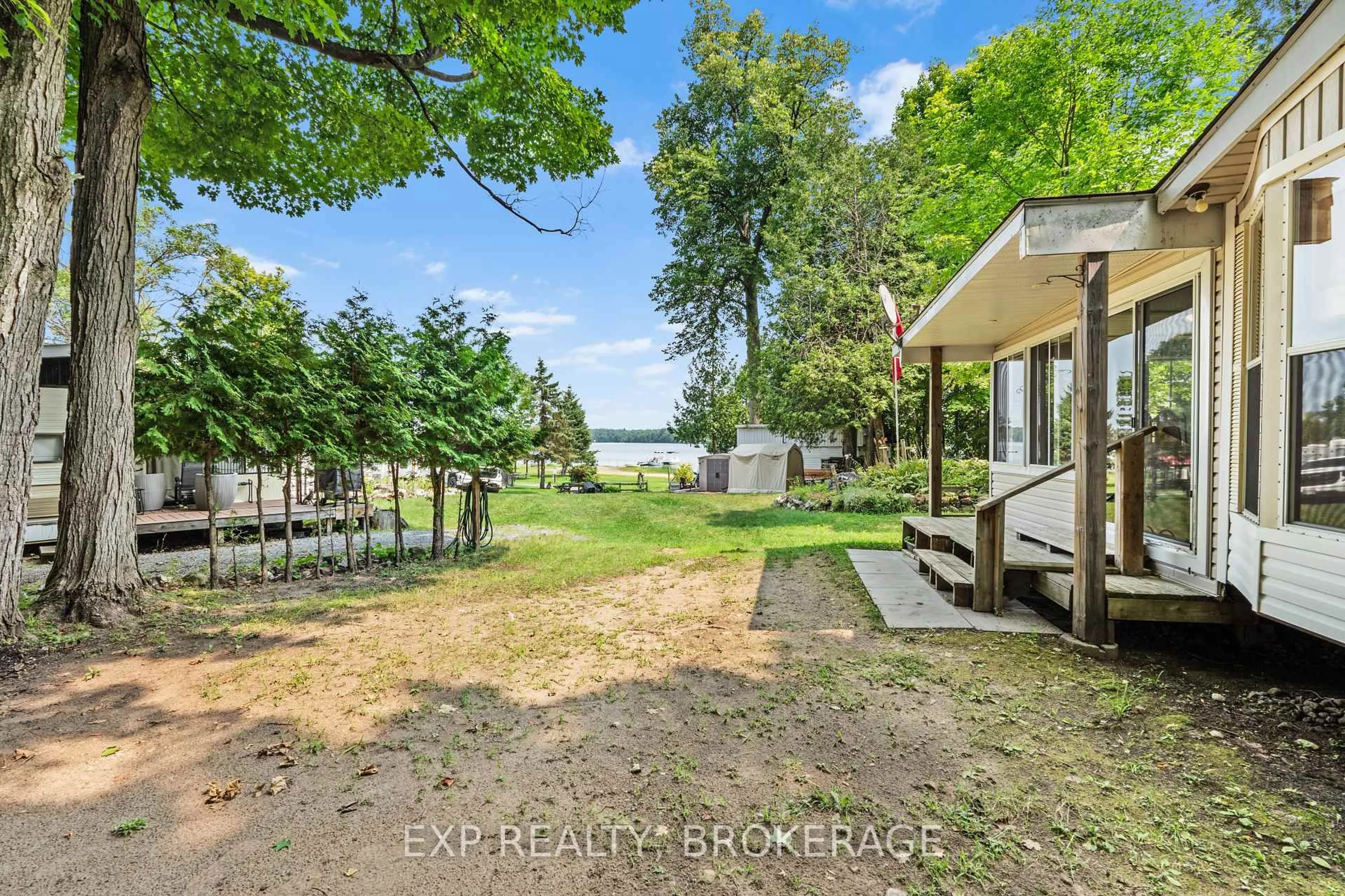 A pic from outside/outdoor area/front of a property/back of a property/a pic from drone, water/lake/river/ocean view for 9 GLENFORD Lane #20, Godfrey Ontario K0H 1T0