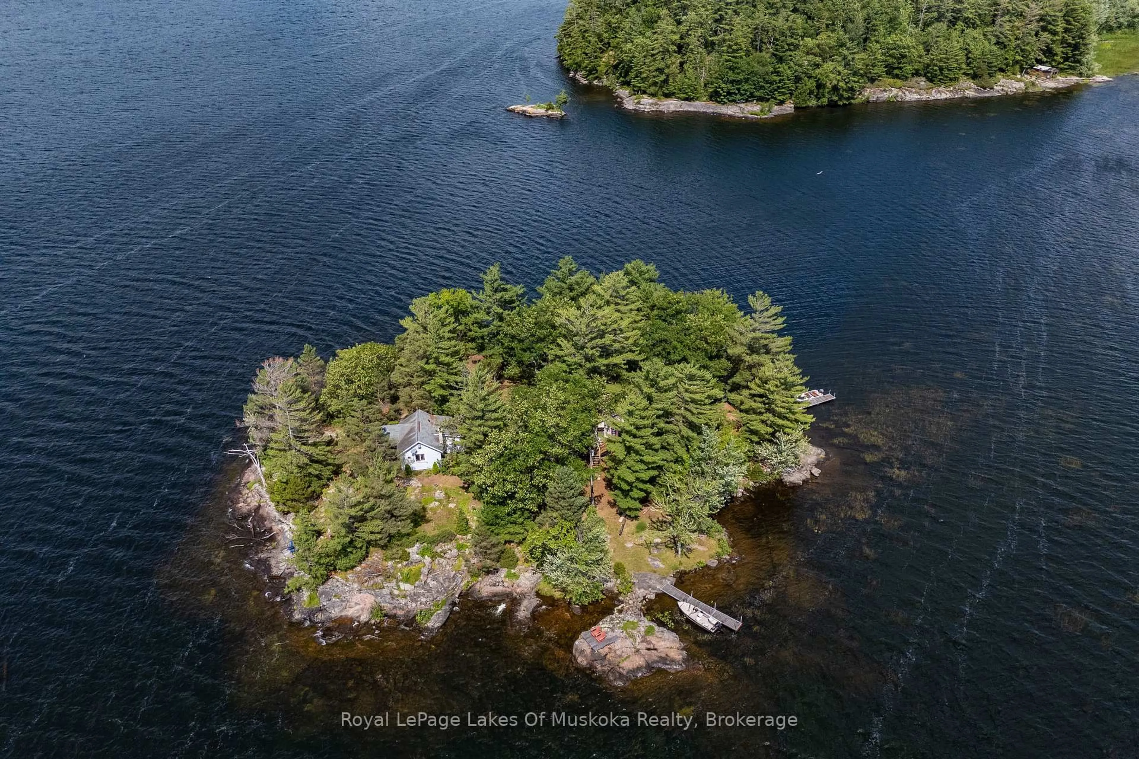 A pic from outside/outdoor area/front of a property/back of a property/a pic from drone, water/lake/river/ocean view for 1 Island 2SL Island, Gravenhurst Ontario P1P 1R1