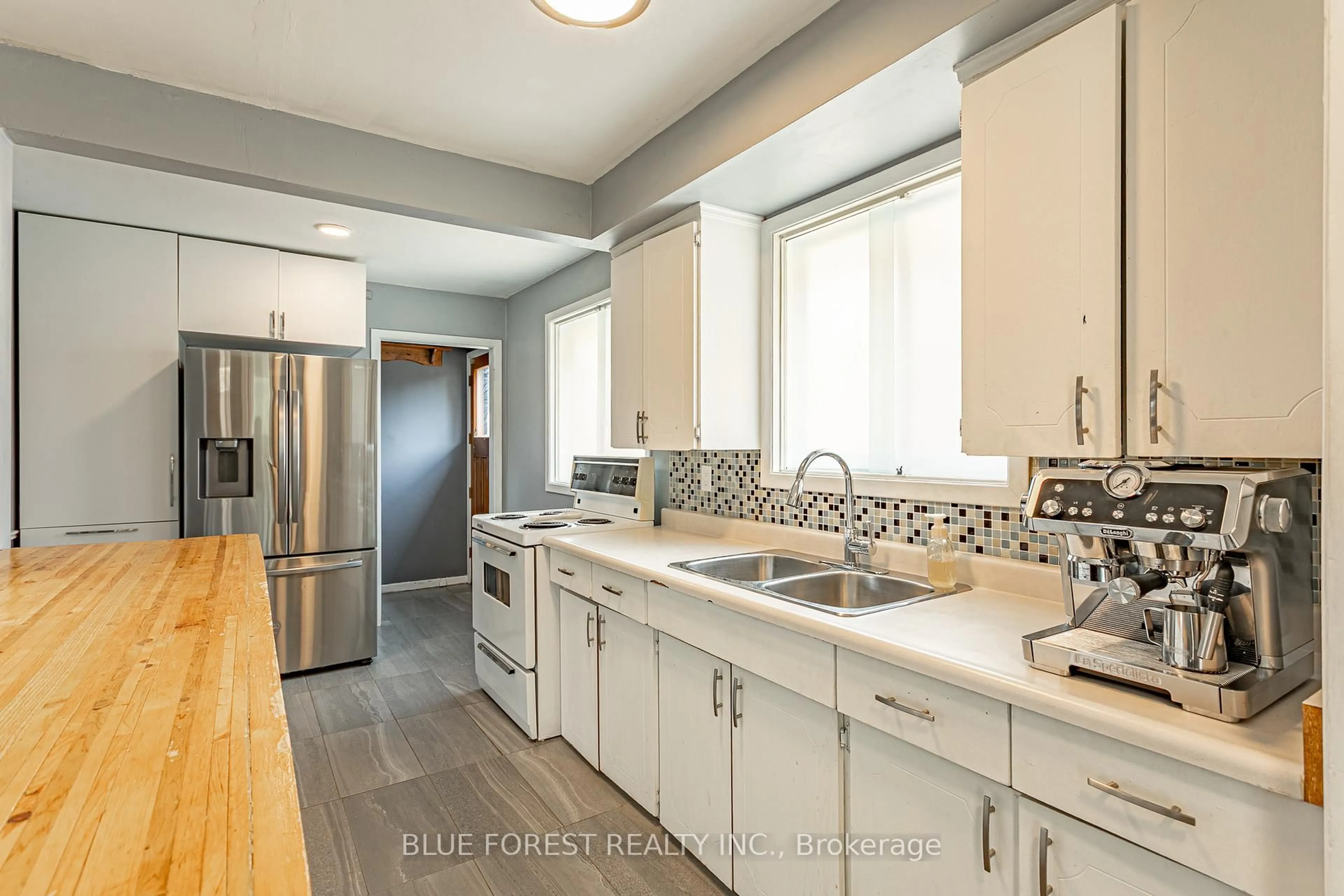 Open concept kitchen, ceramic/tile floor for 2 Surrey Cres, London South Ontario N6E 1T6
