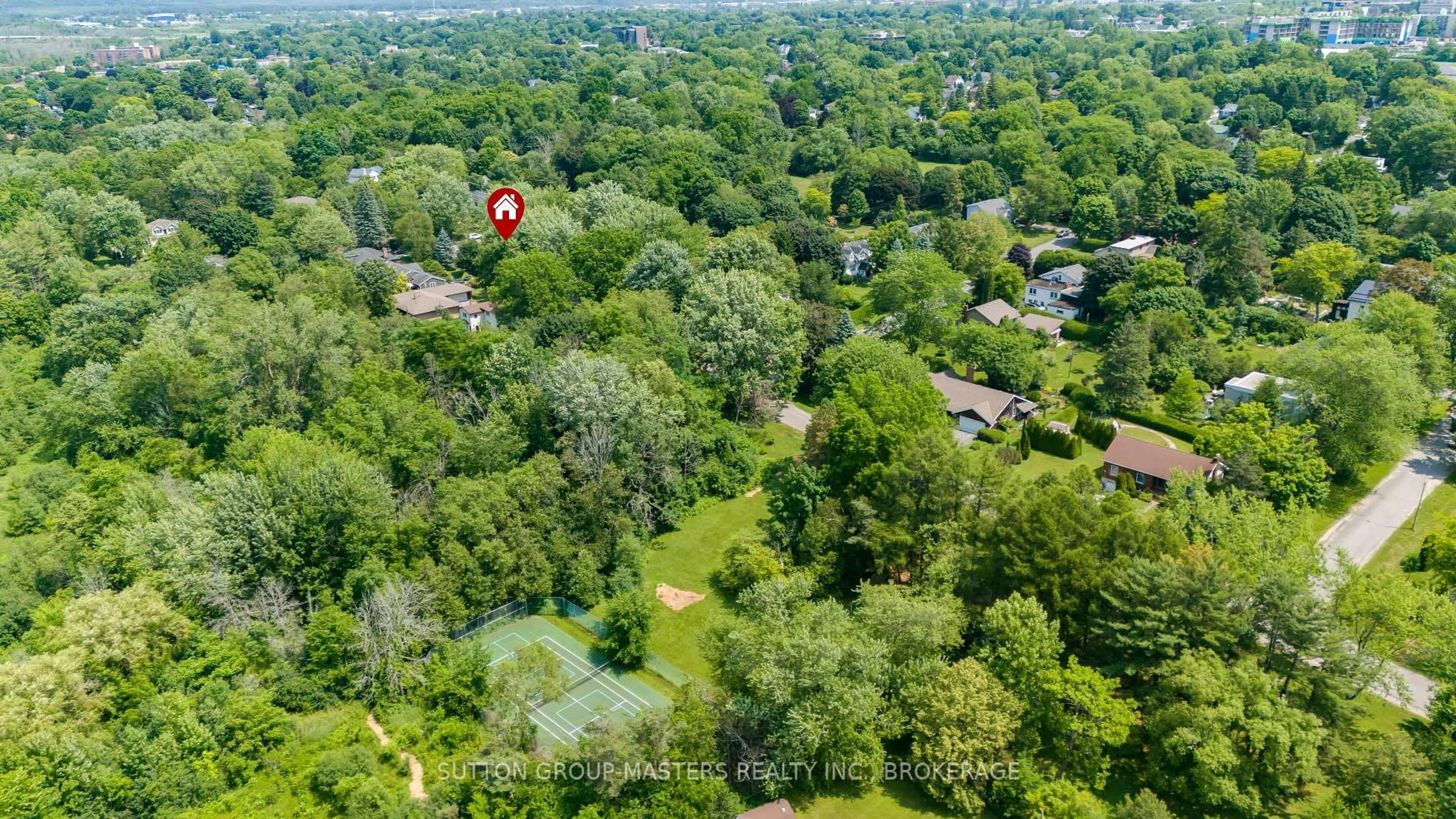 A pic from outside/outdoor area/front of a property/back of a property/a pic from drone, forest/trees view for 11 Grenville Rd, Kingston Ontario K7M 2C7