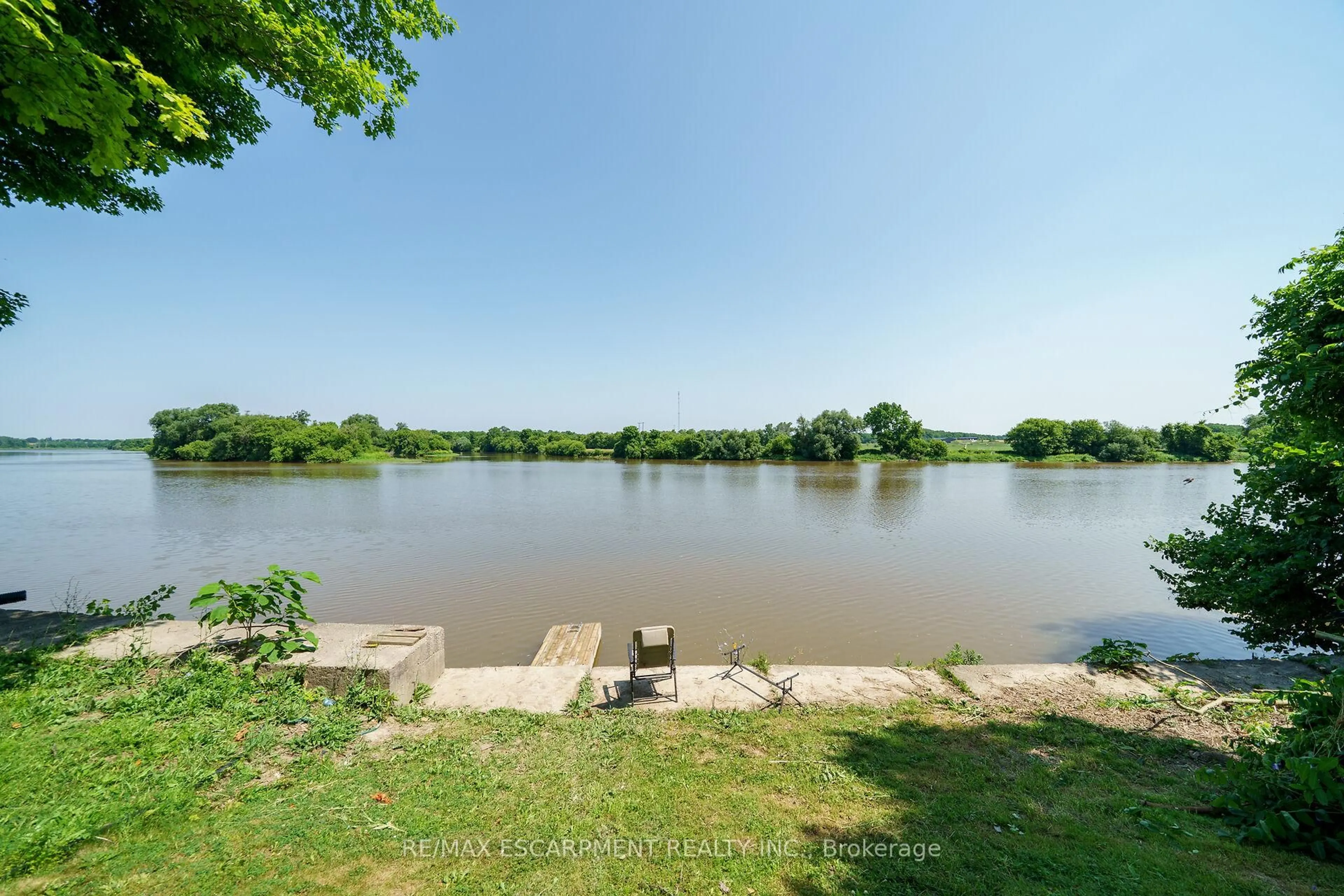 A pic from outside/outdoor area/front of a property/back of a property/a pic from drone, water/lake/river/ocean view for 1896 River Rd, Haldimand Ontario N0A 1E0