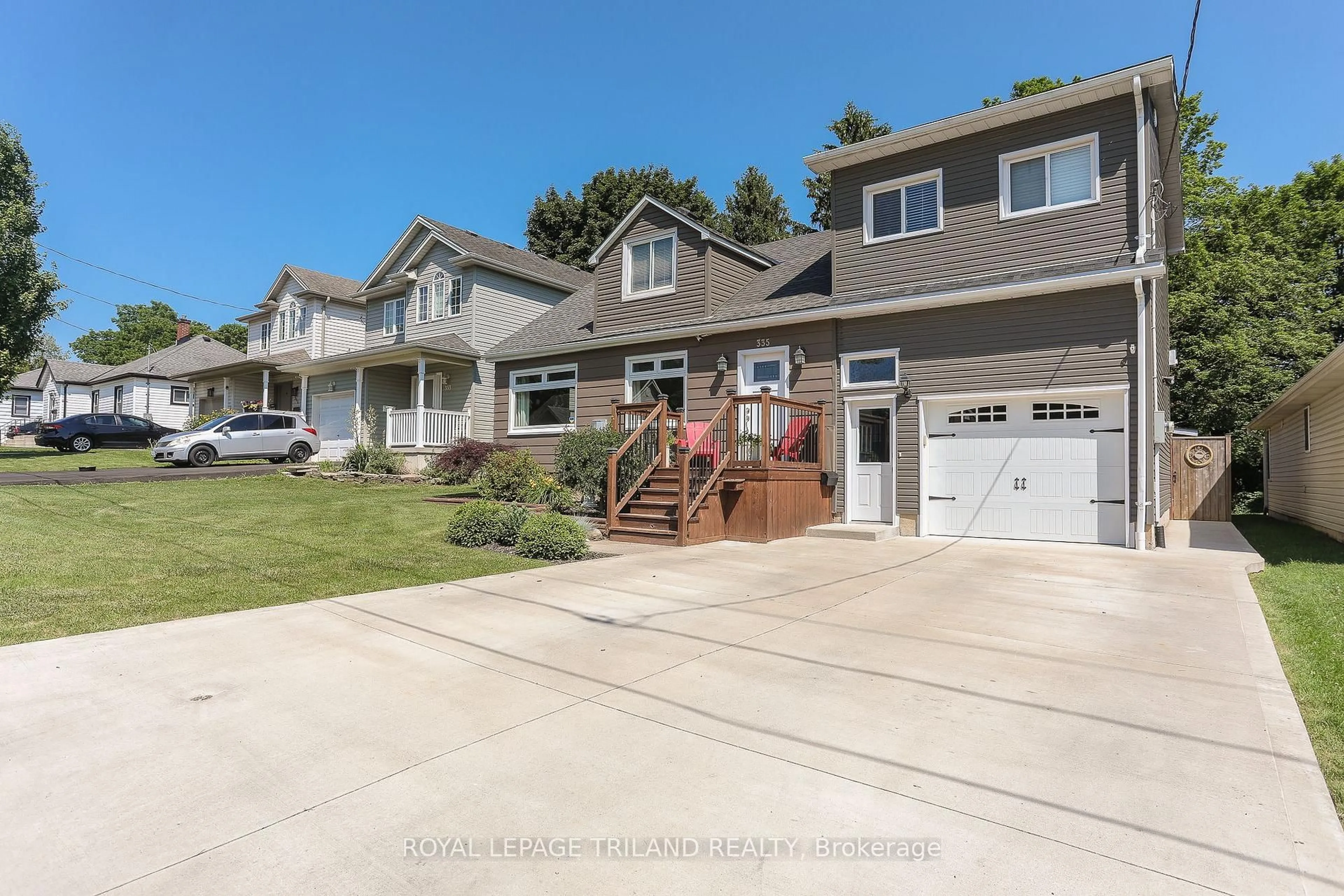Home with vinyl exterior material, street for 335 Kendall Ave, Woodstock Ontario N4S 2B7