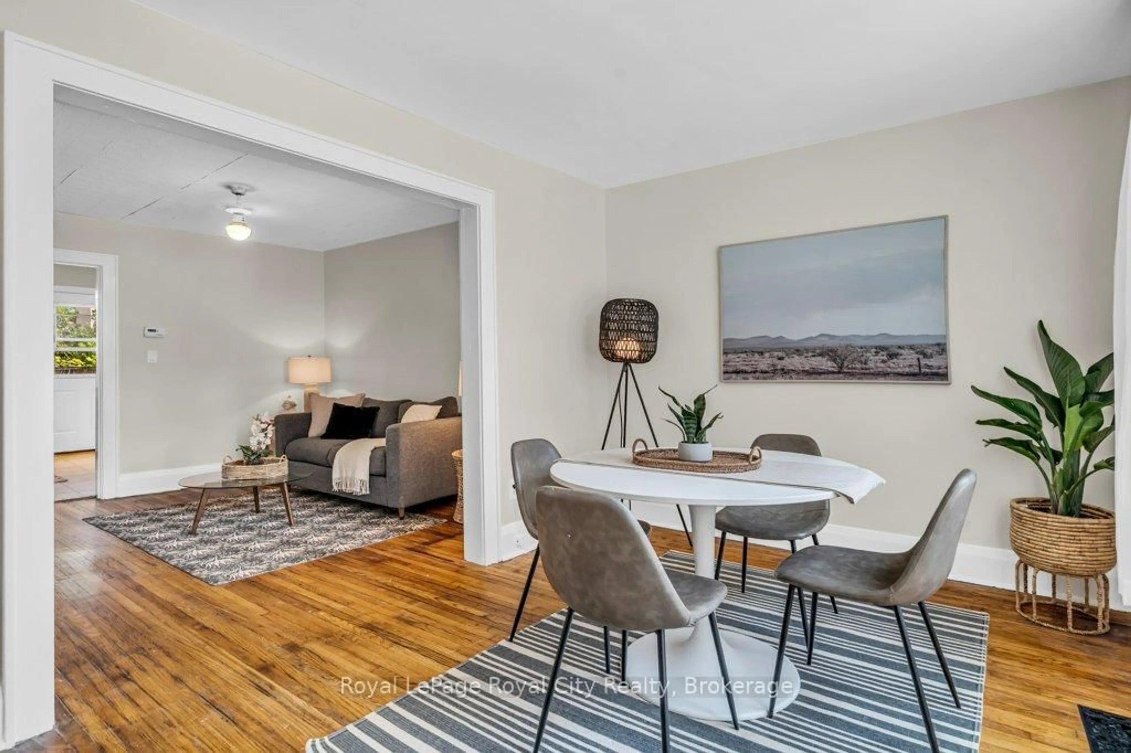 Living room with furniture, wood/laminate floor for 104 Neeve St, Guelph Ontario N1E 5S1