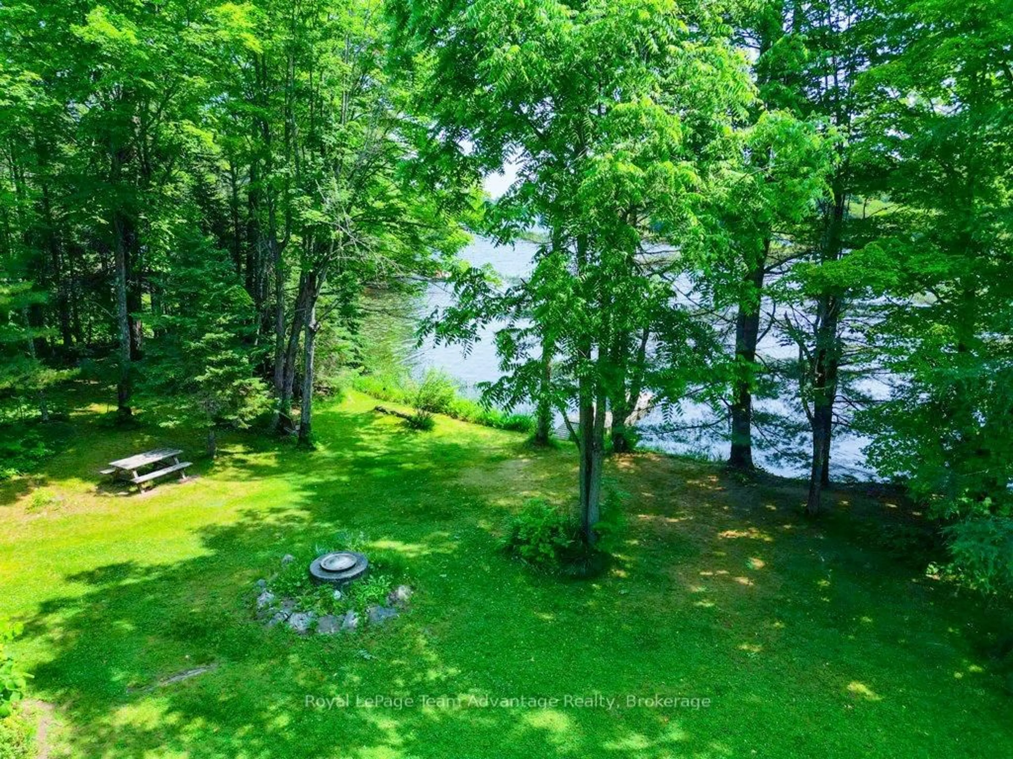 A pic from outside/outdoor area/front of a property/back of a property/a pic from drone, water/lake/river/ocean view for 11 Birch Lane, McDougall Ontario P2A 2W7