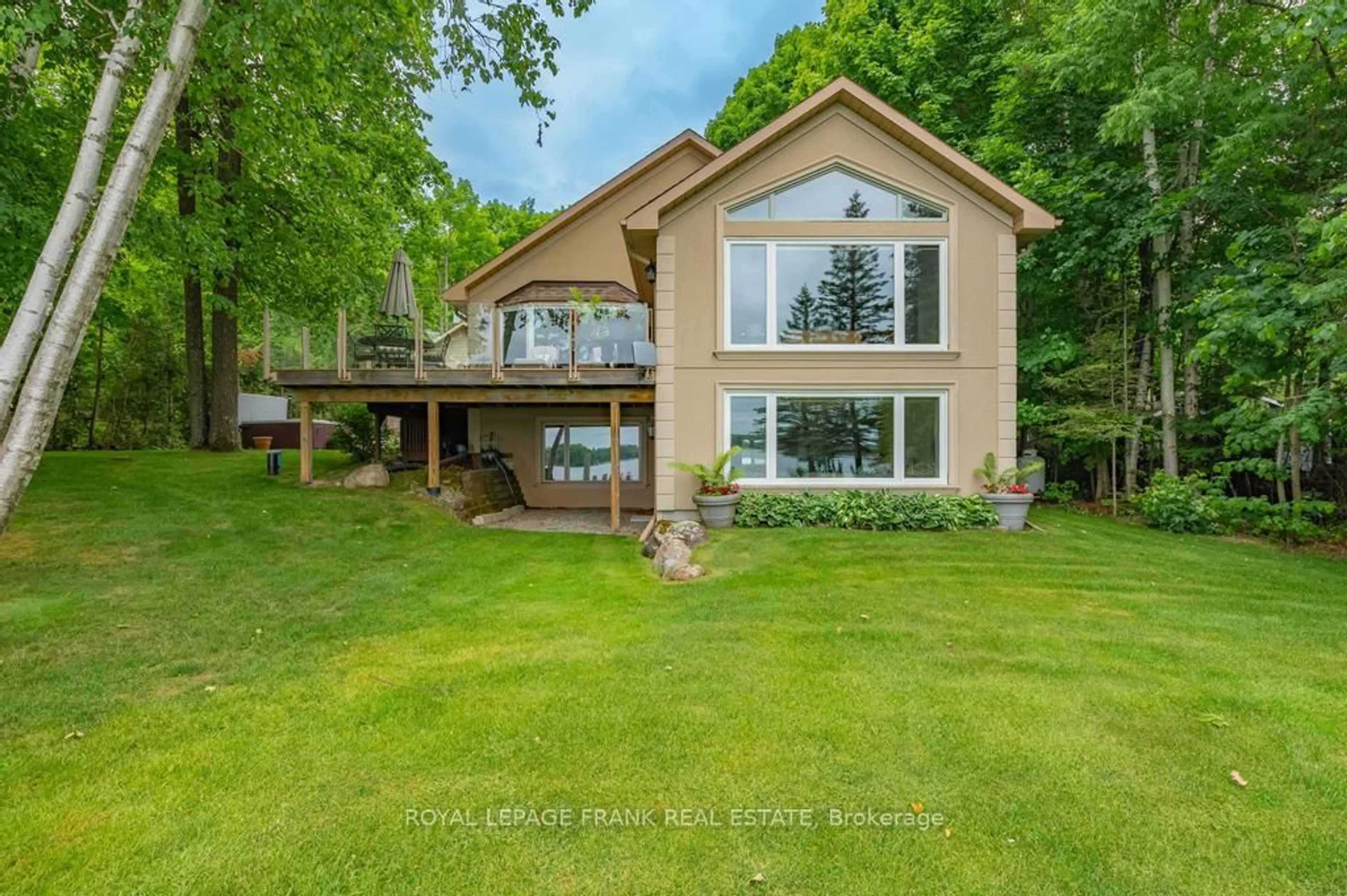 A pic from outside/outdoor area/front of a property/back of a property/a pic from drone, water/lake/river/ocean view for 60 Mystic Point Rd, Trent Lakes Ontario K0L 1J0