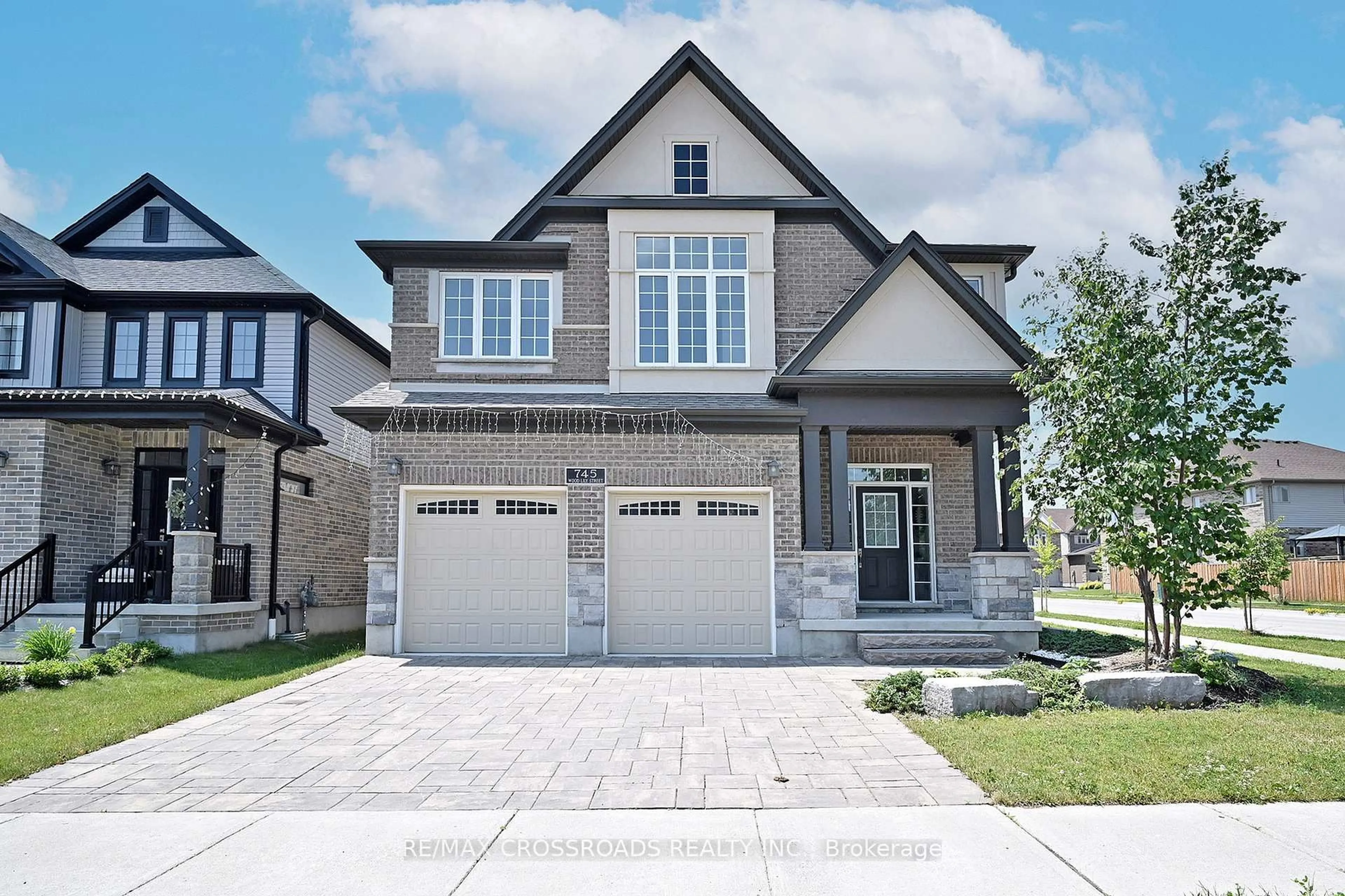 Home with brick exterior material, street for 745 Wood Lily St, Waterloo Ontario N2V 0C3
