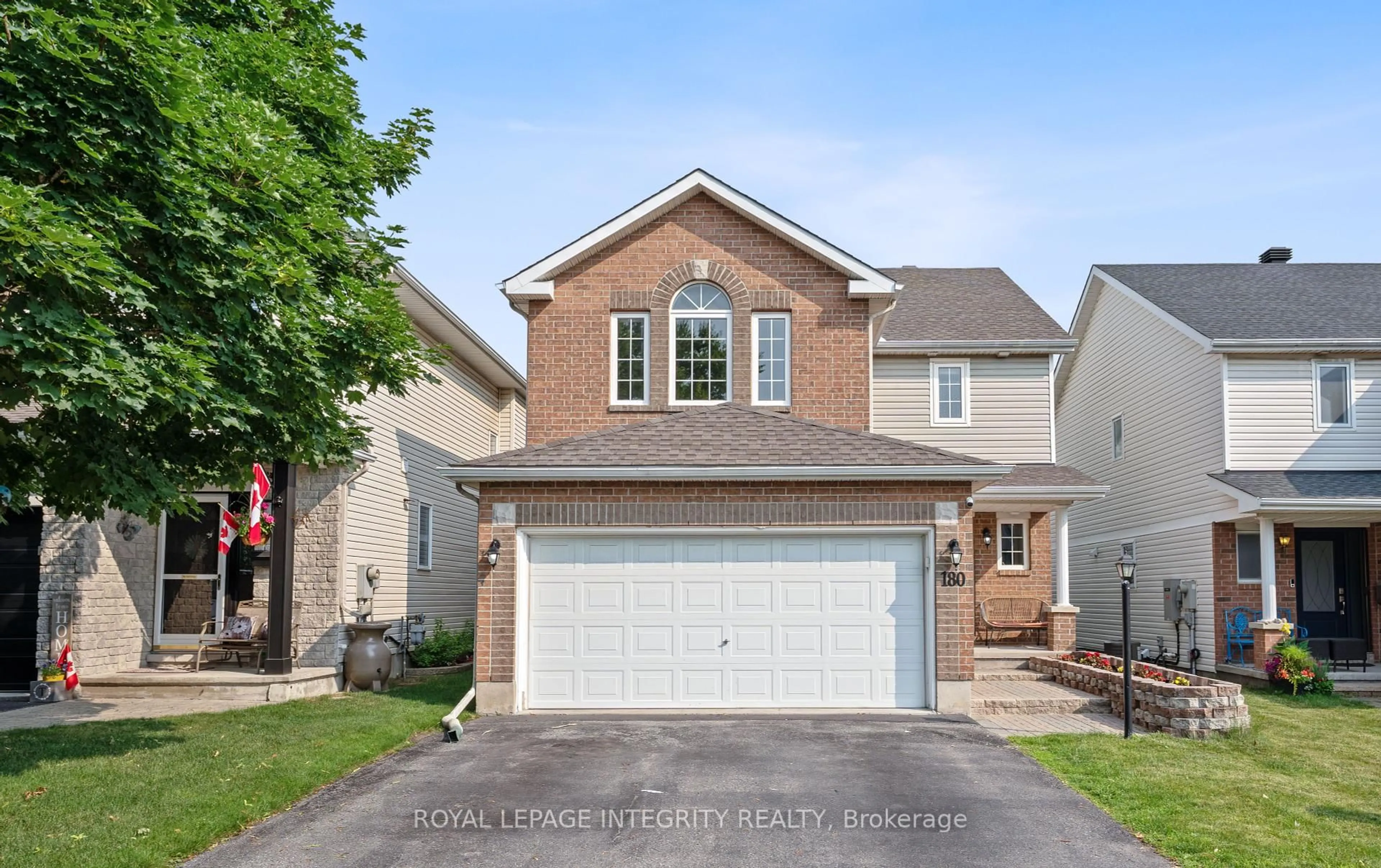 Home with vinyl exterior material, street for 180 Deerfox Dr, Ottawa Ontario K2J 4W8