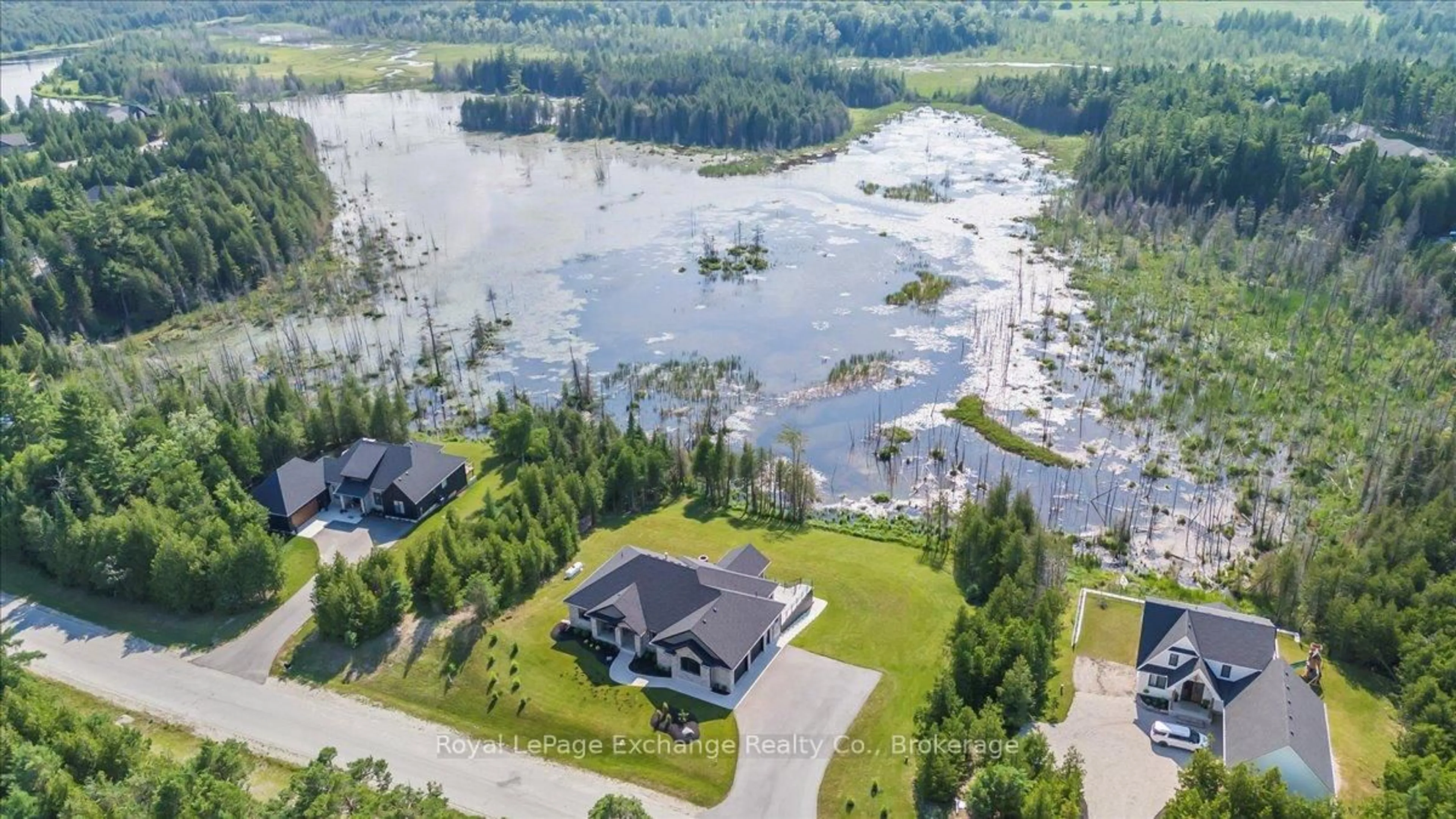 A pic from outside/outdoor area/front of a property/back of a property/a pic from drone, water/lake/river/ocean view for 150 Louise Creek Cres, West Grey Ontario N0G 1S0