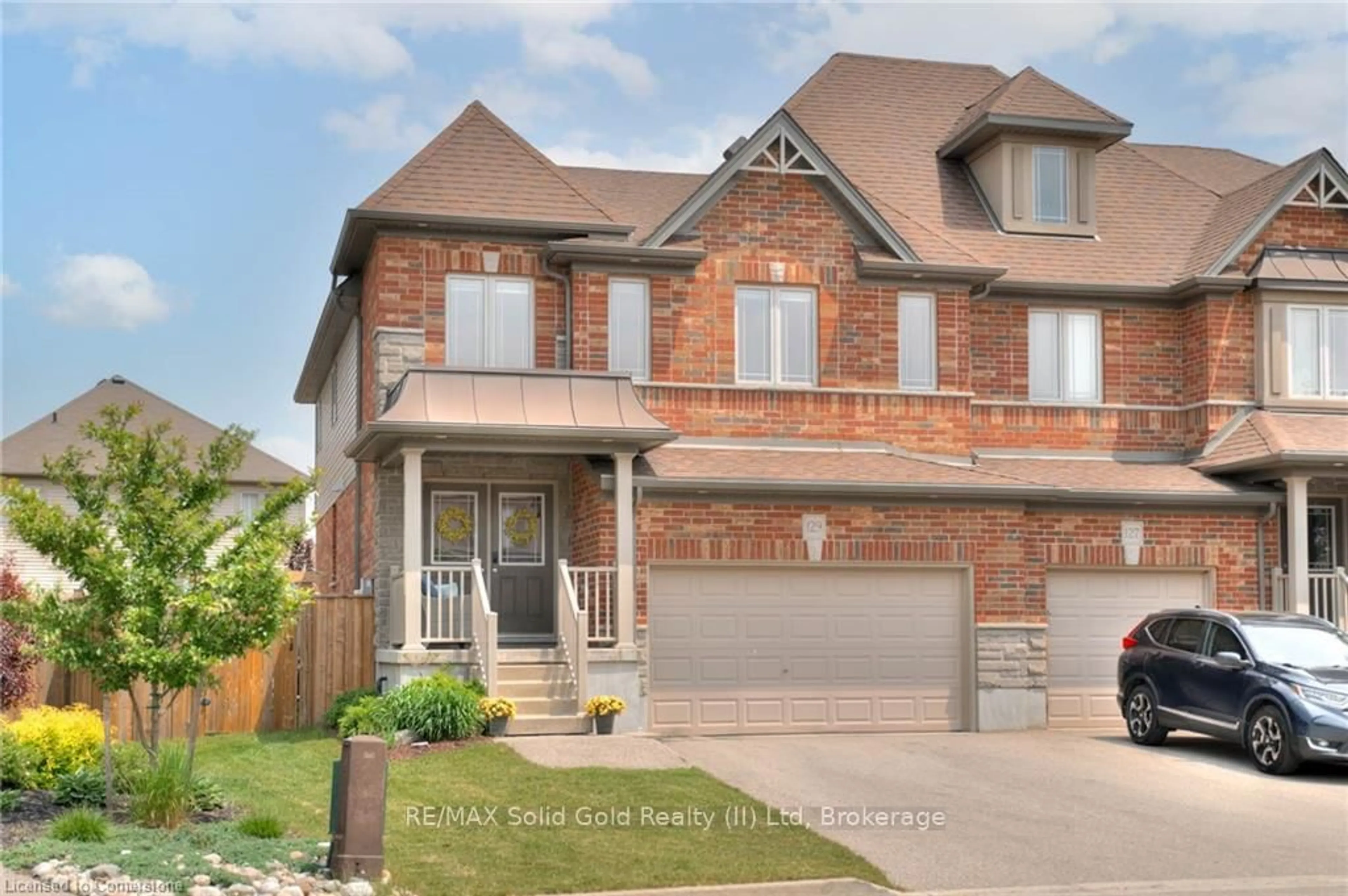 Home with brick exterior material, street for 129 Coopershawk St, Kitchener Ontario N2K 4J8