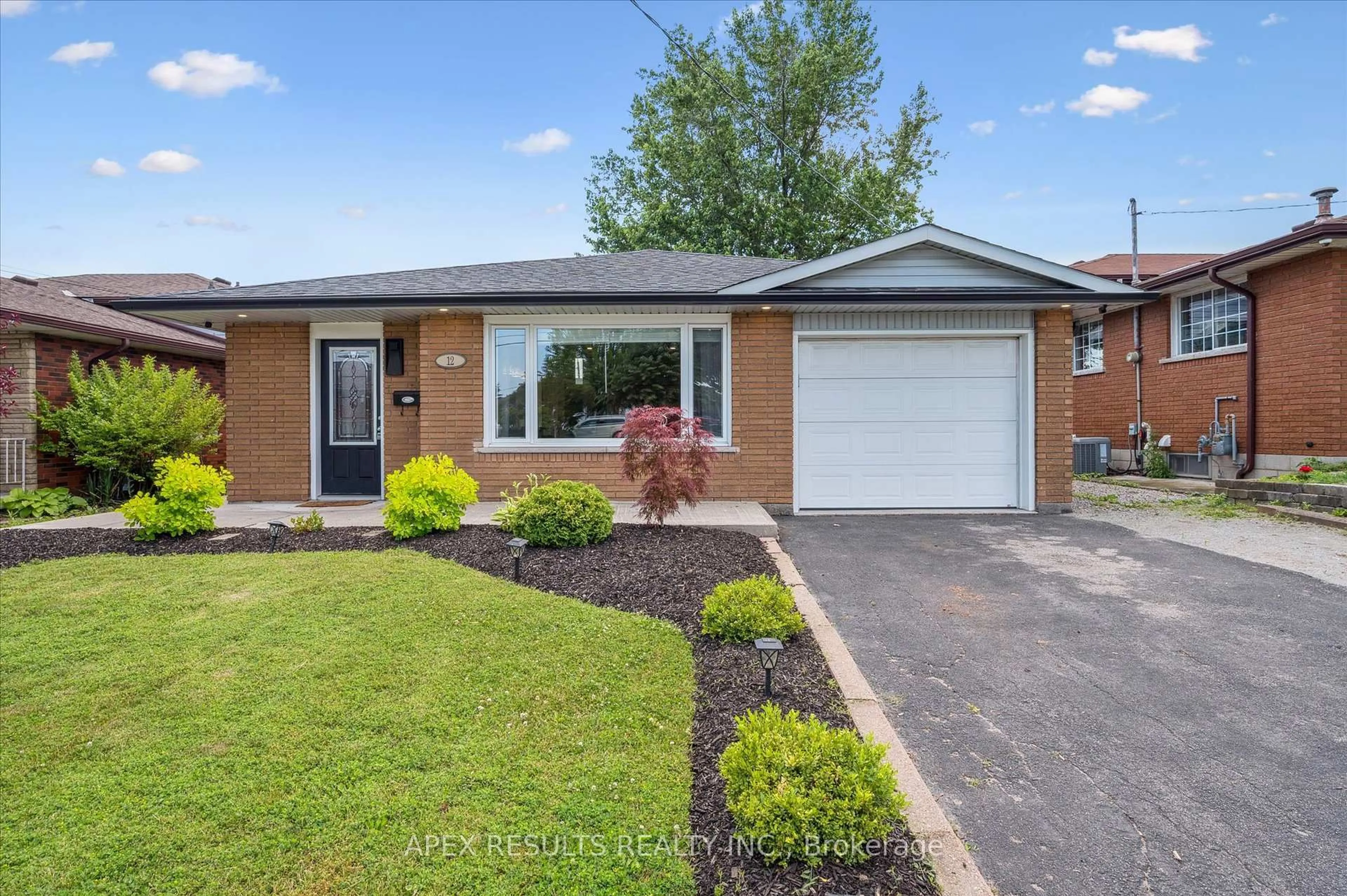 Home with brick exterior material, street for 12 Anson Ave, Hamilton Ontario L8T 2X3