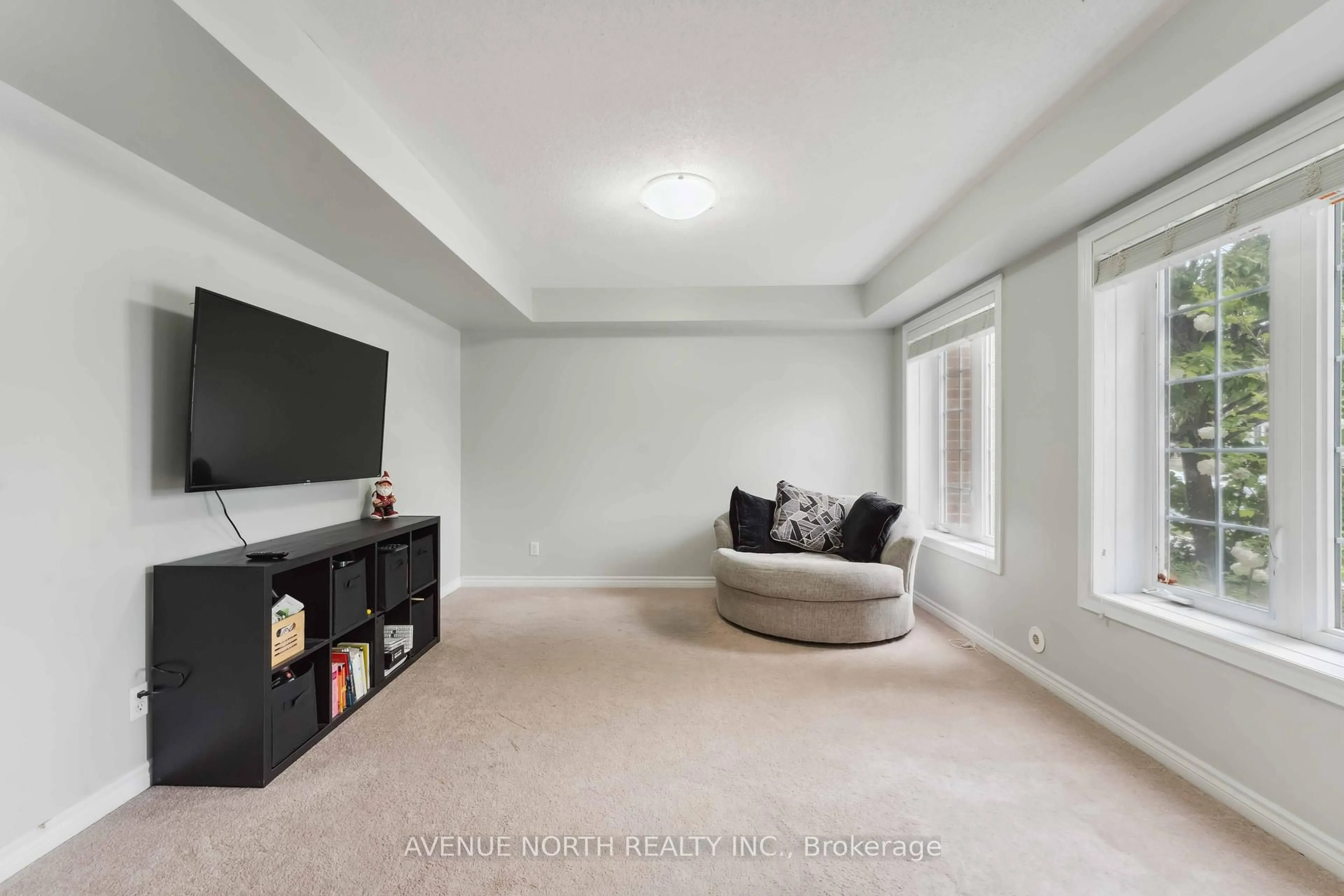 Living room with furniture, carpet floor for 112 Huntmar Dr, Ottawa Ontario K2S 0E3
