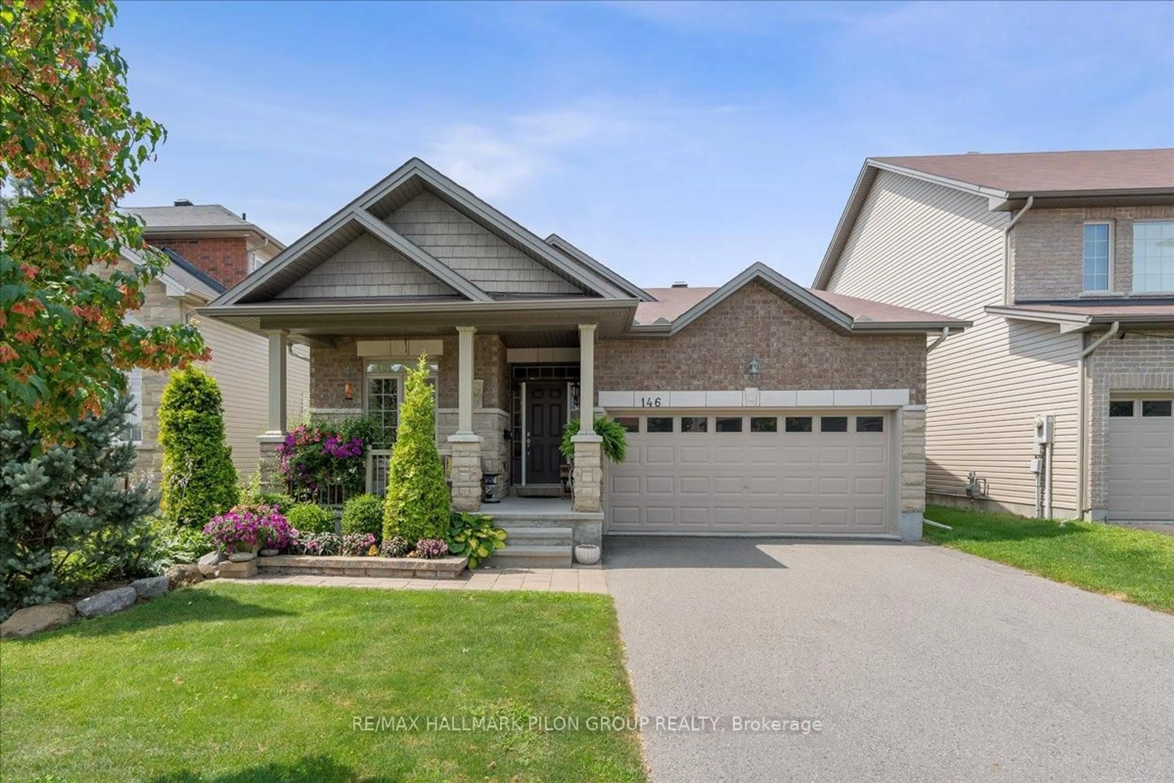 Home with vinyl exterior material, street for 146 Esterbrook Dr, Ottawa Ontario K1W 0H2
