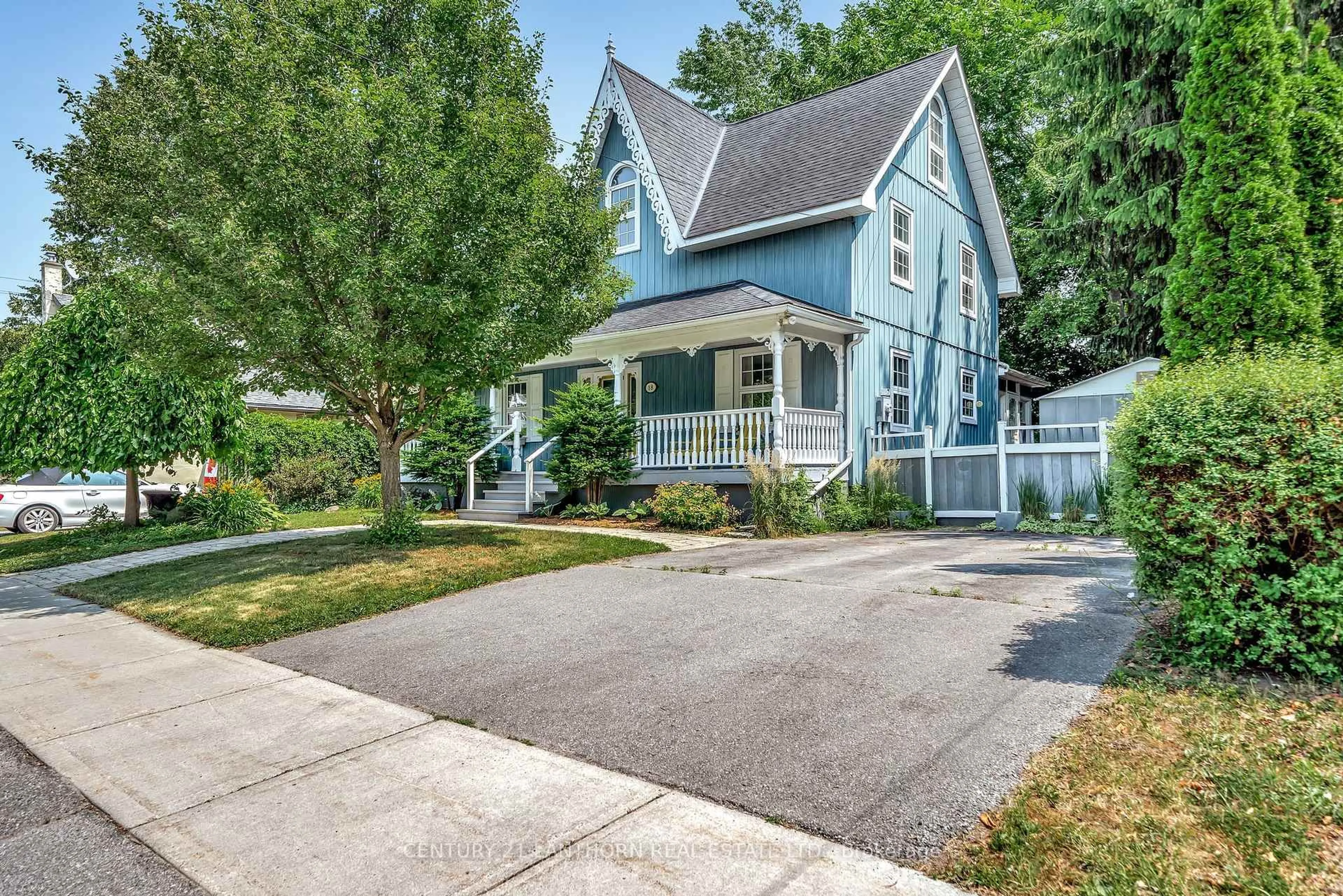 Home with vinyl exterior material, street for 18 QUEEN St, Prince Edward County Ontario K0K 2T0