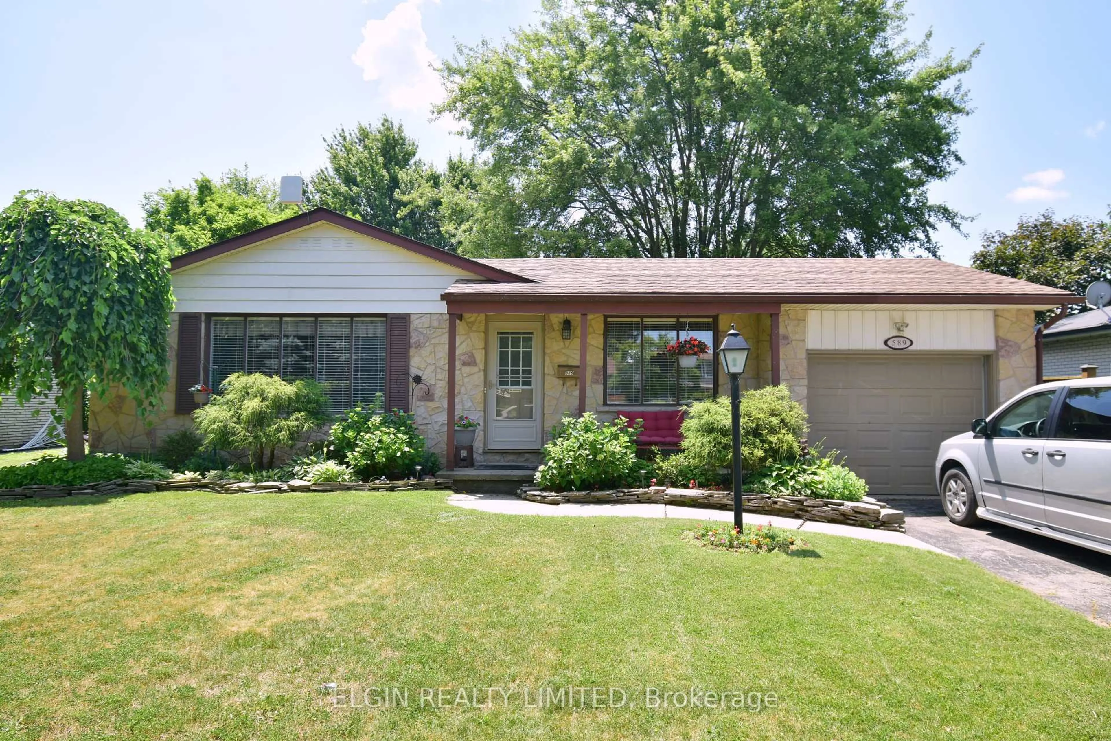 Home with brick exterior material, street for 589 Elm St, St. Thomas Ontario N5R 1K8