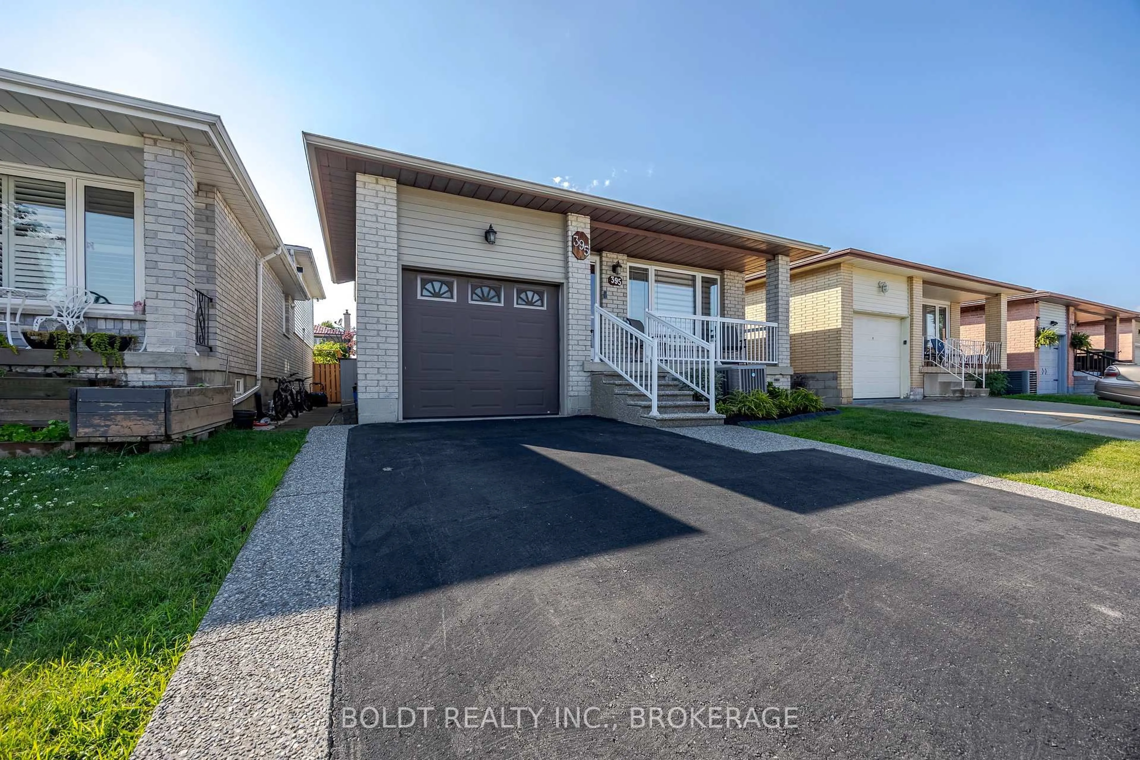Home with vinyl exterior material, street for 395 Rexford Dr, Hamilton Ontario L8W 2M4