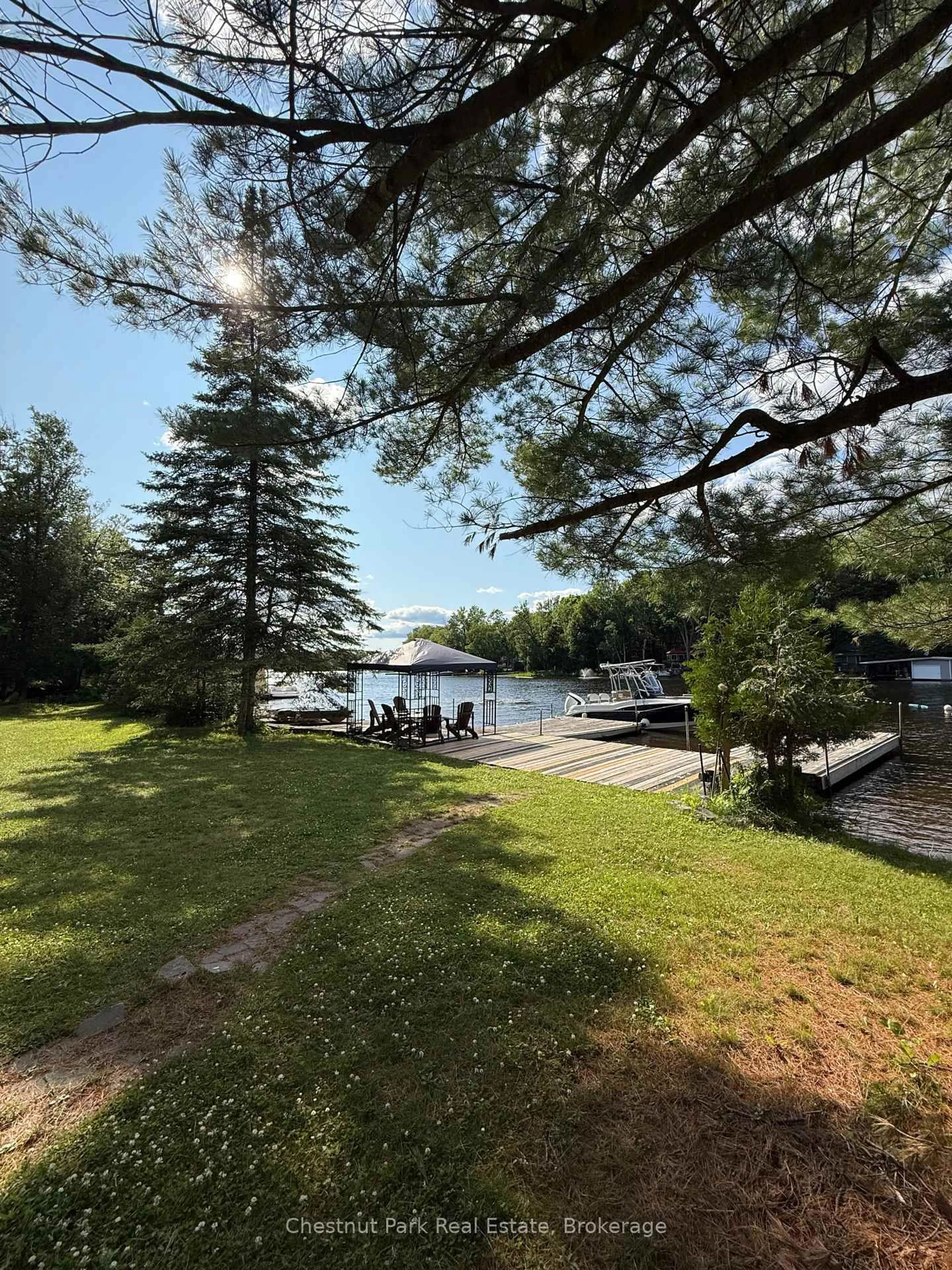 A pic from outside/outdoor area/front of a property/back of a property/a pic from drone, water/lake/river/ocean view for 30 Mcvittie Island, Bracebridge Ontario P1L 1W4