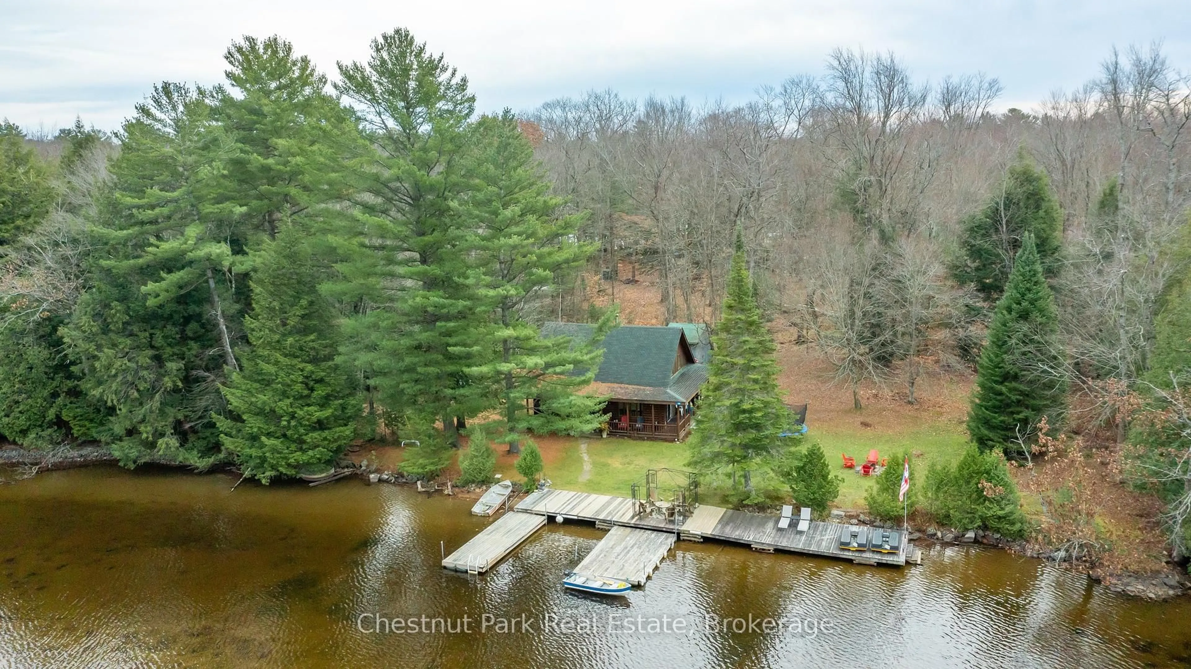 A pic from outside/outdoor area/front of a property/back of a property/a pic from drone, water/lake/river/ocean view for 30 Mcvittie Island, Bracebridge Ontario P1L 1W4