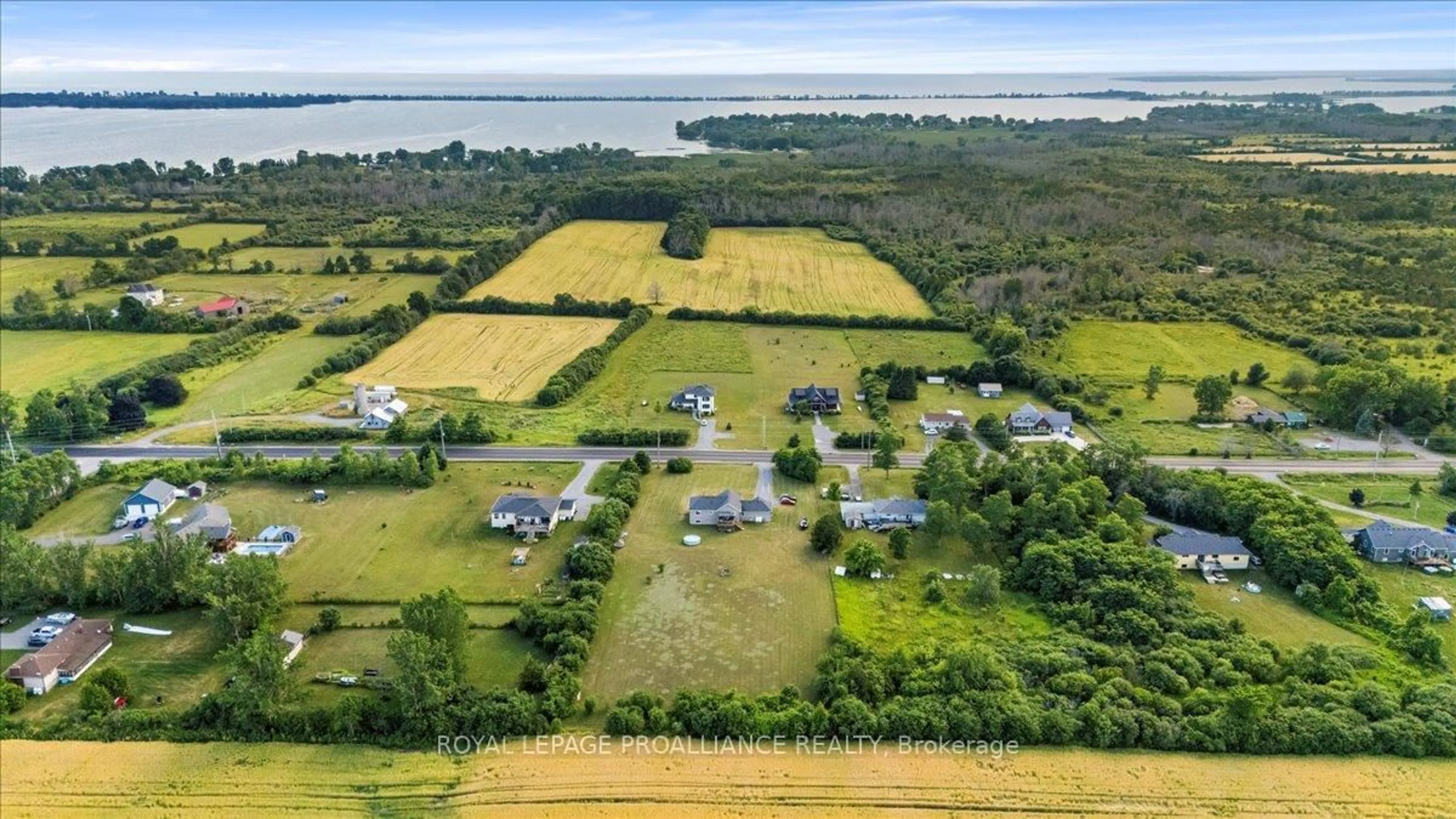 A pic from outside/outdoor area/front of a property/back of a property/a pic from drone, water/lake/river/ocean view for 20846 Loyalist Parkway, Prince Edward County Ontario K0K 1T0