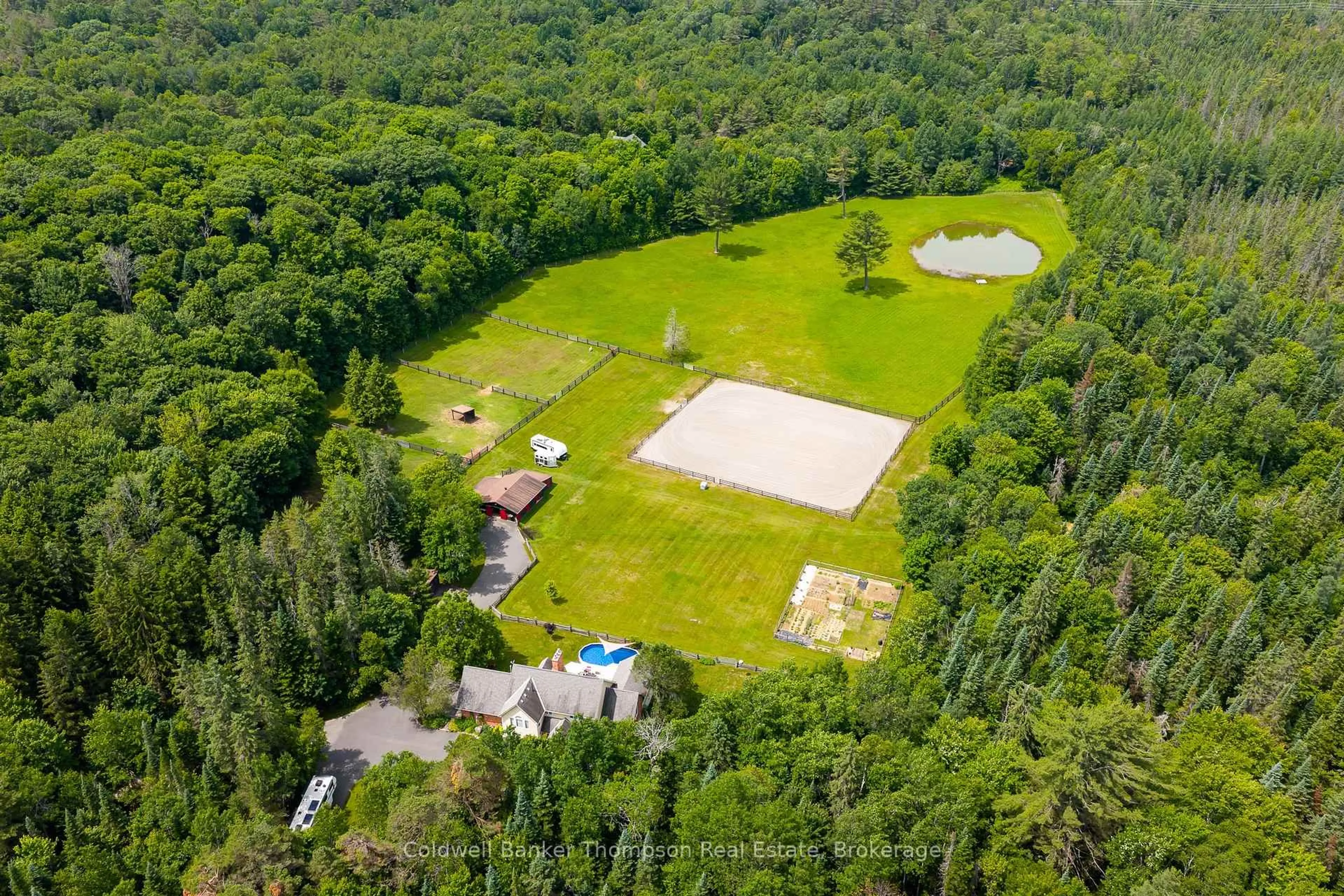 A pic from outside/outdoor area/front of a property/back of a property/a pic from drone, forest/trees view for 90 Northwoods Dr, Huntsville Ontario P0B 1L0