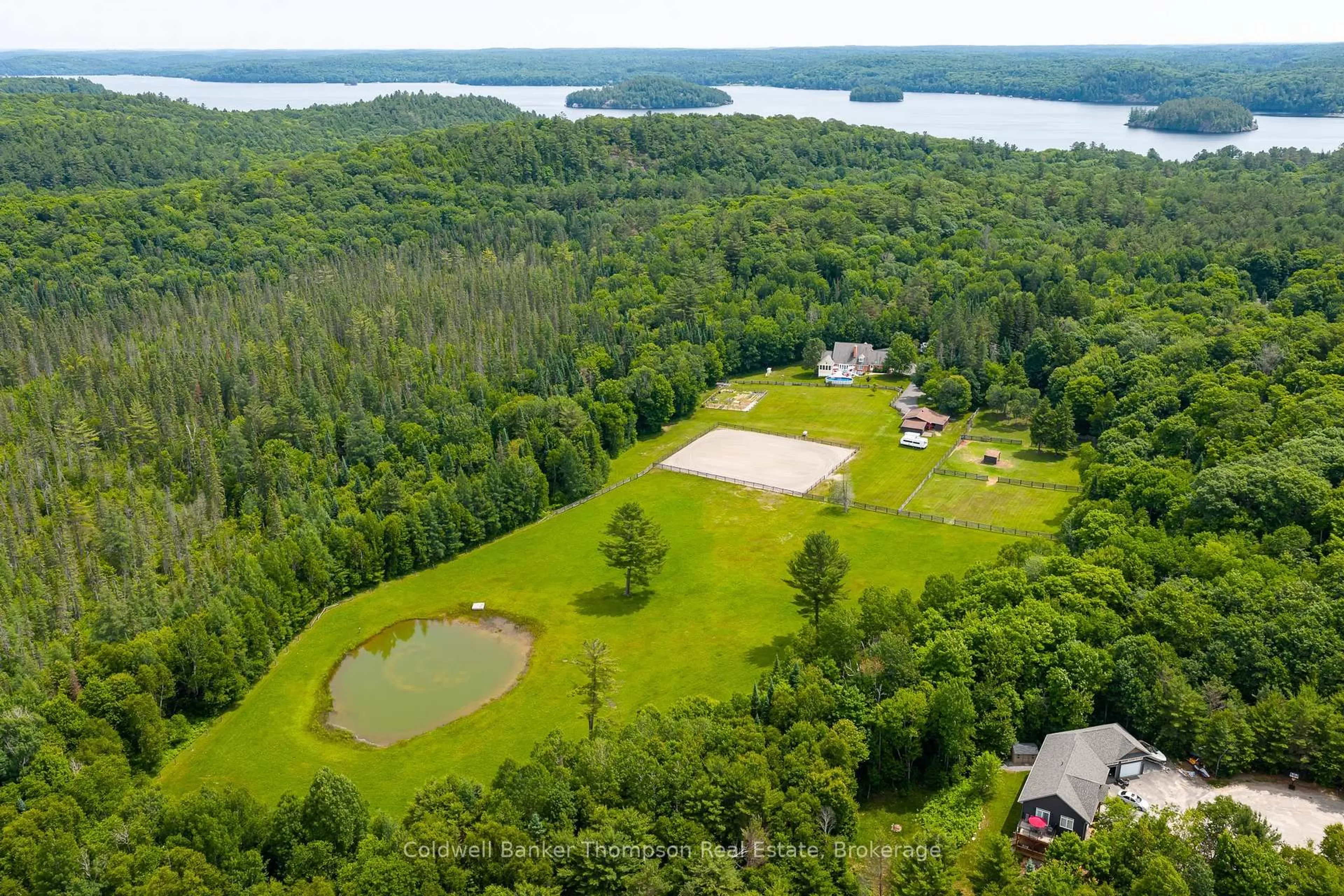 A pic from outside/outdoor area/front of a property/back of a property/a pic from drone, water/lake/river/ocean view for 90 Northwoods Dr, Huntsville Ontario P0B 1L0