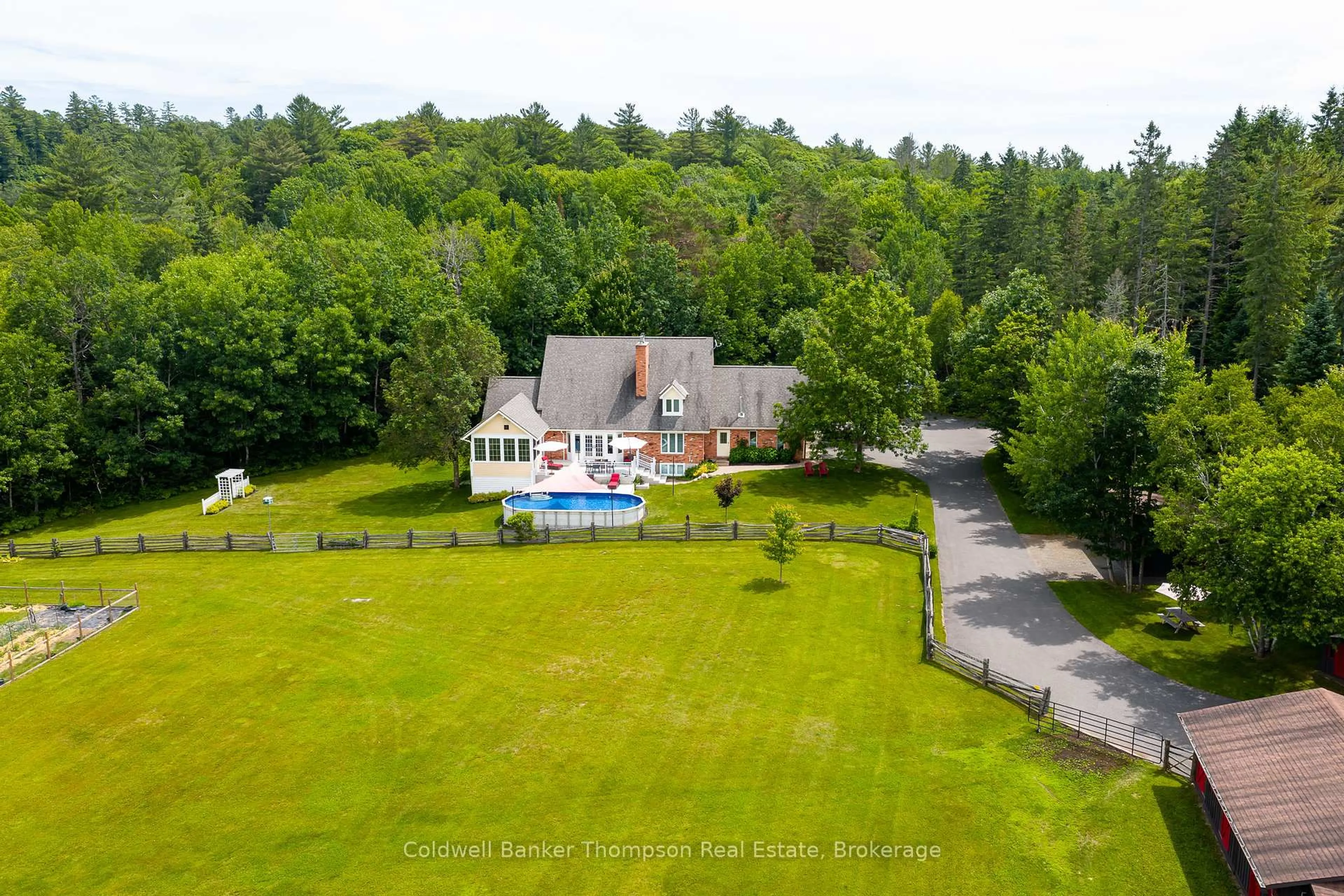 A pic from outside/outdoor area/front of a property/back of a property/a pic from drone, water/lake/river/ocean view for 90 Northwoods Dr, Huntsville Ontario P0B 1L0