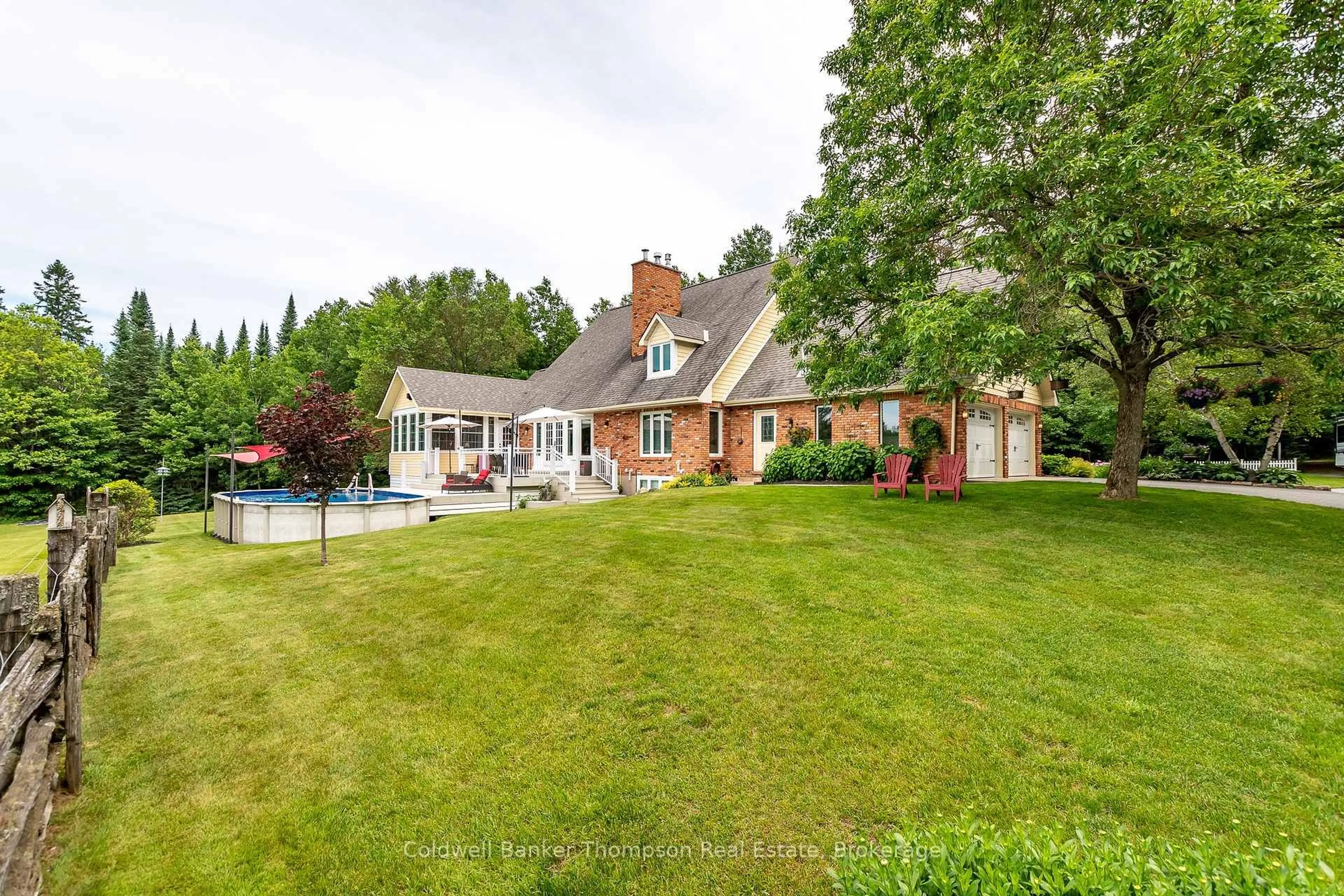 A pic from outside/outdoor area/front of a property/back of a property/a pic from drone, water/lake/river/ocean view for 90 Northwoods Dr, Huntsville Ontario P0B 1L0