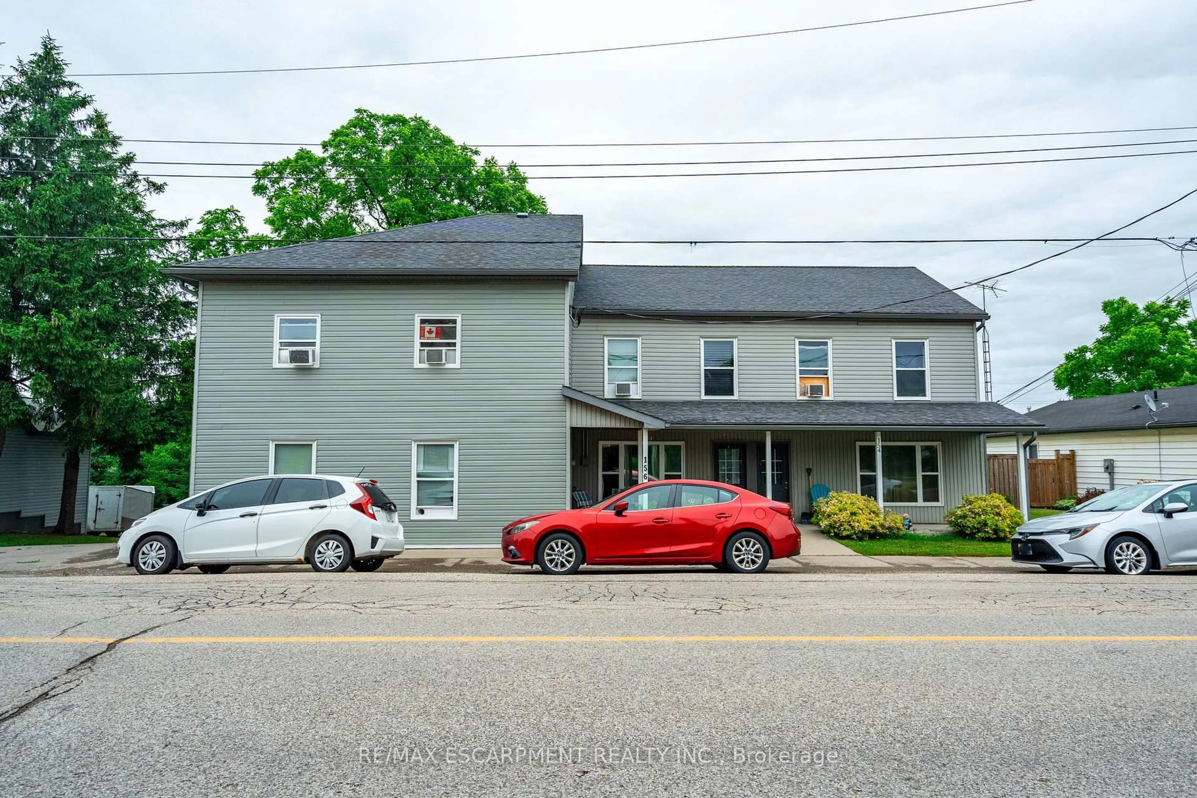 A pic from outside/outdoor area/front of a property/back of a property/a pic from drone, street for 156 Freelton Rd #154, Hamilton Ontario L8B 0Z5